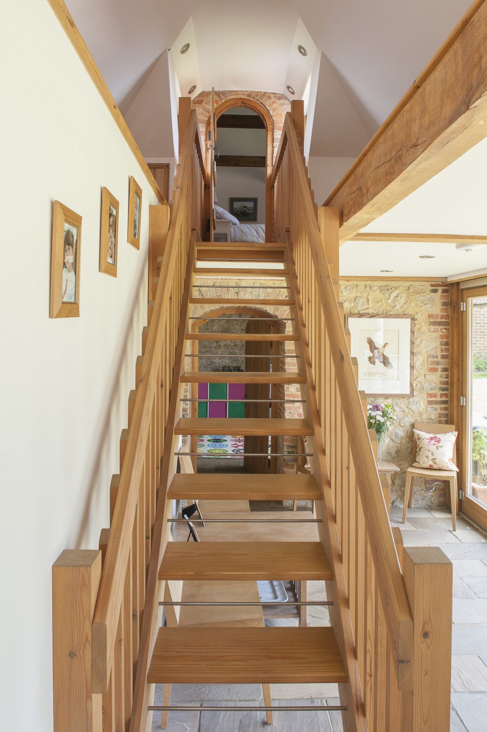 At one end of the kitchen, a staircase leads to the guest bedroom and en suite shower room