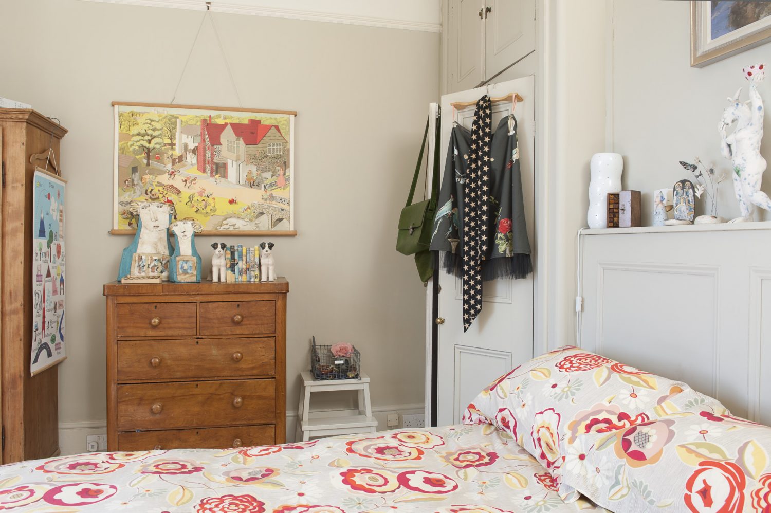 The bed in the master bedroom is dressed with bright, Collier Campbell bedlinen featuring a zinnia-like floral pattern