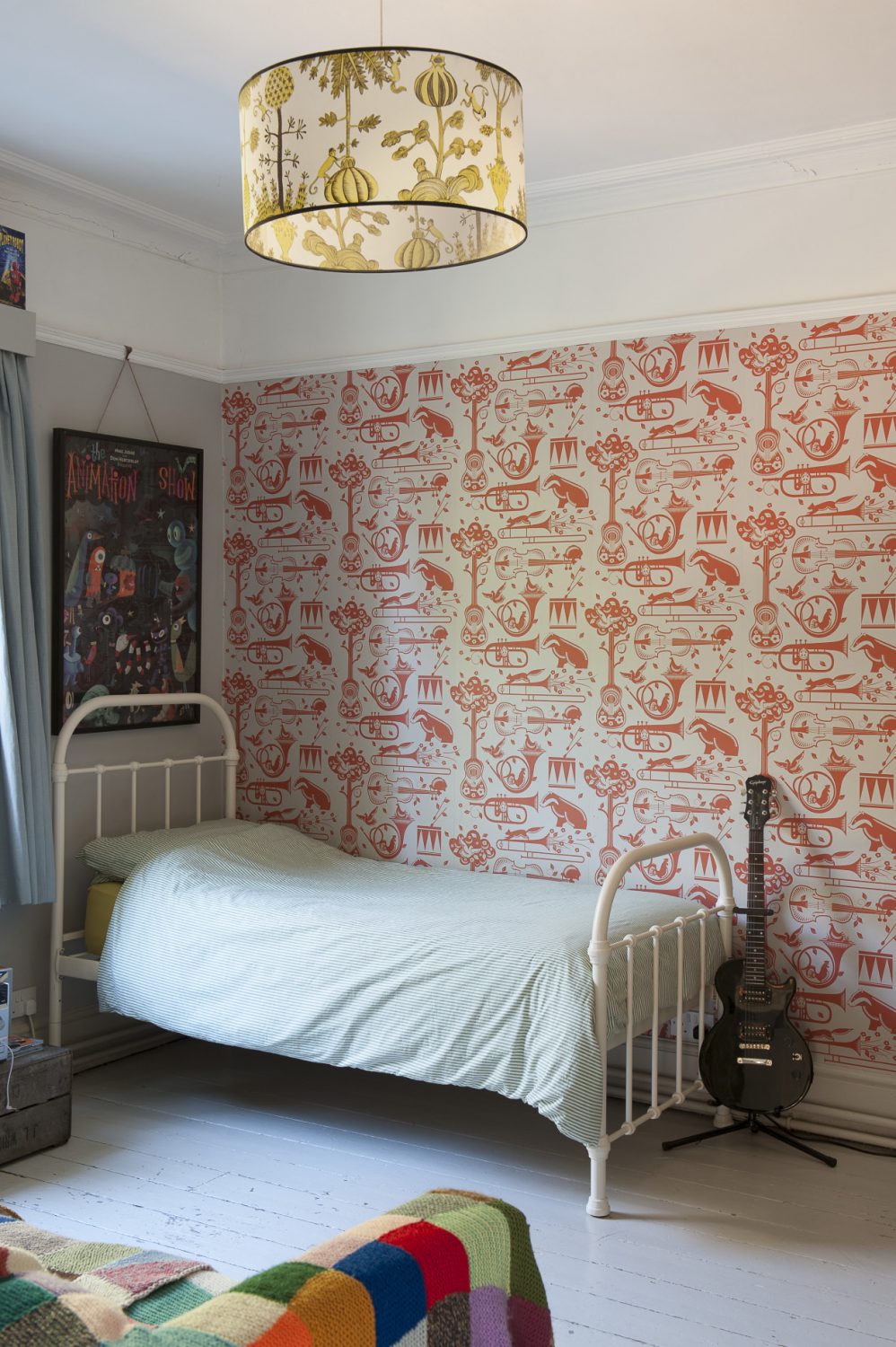 the Mini Moderns wallpaper that features an eccentric mix of French horns, drums, cockerels and badgers