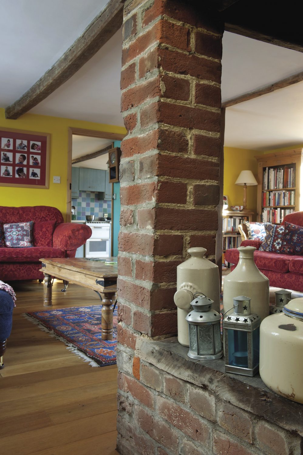 The focal pnt of the sitting room is a huge brick inglenook fireplace with a woodburning stove