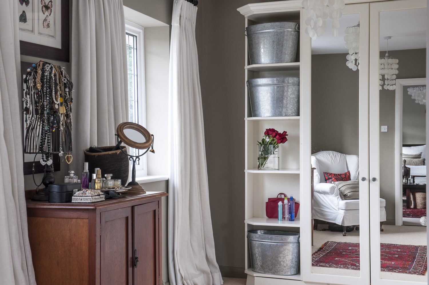 The bright dressing room provides ample storage for clothes and accessories