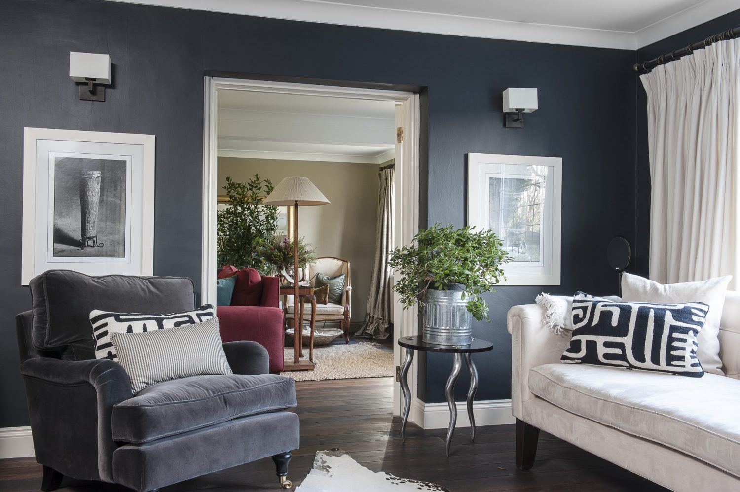 The walls of the grown-ups’ snug, painted in Farrow & Ball ‘Off Black’, creates an inviting and cosy evening retreat. “I often think darker colours are more neutral than white,” says Adele. “They often make spaces look larger rather than smaller and add depth and warmth.” The sofa is flanked by two superb tables with brushed aluminium legs in the shape of kudu horns