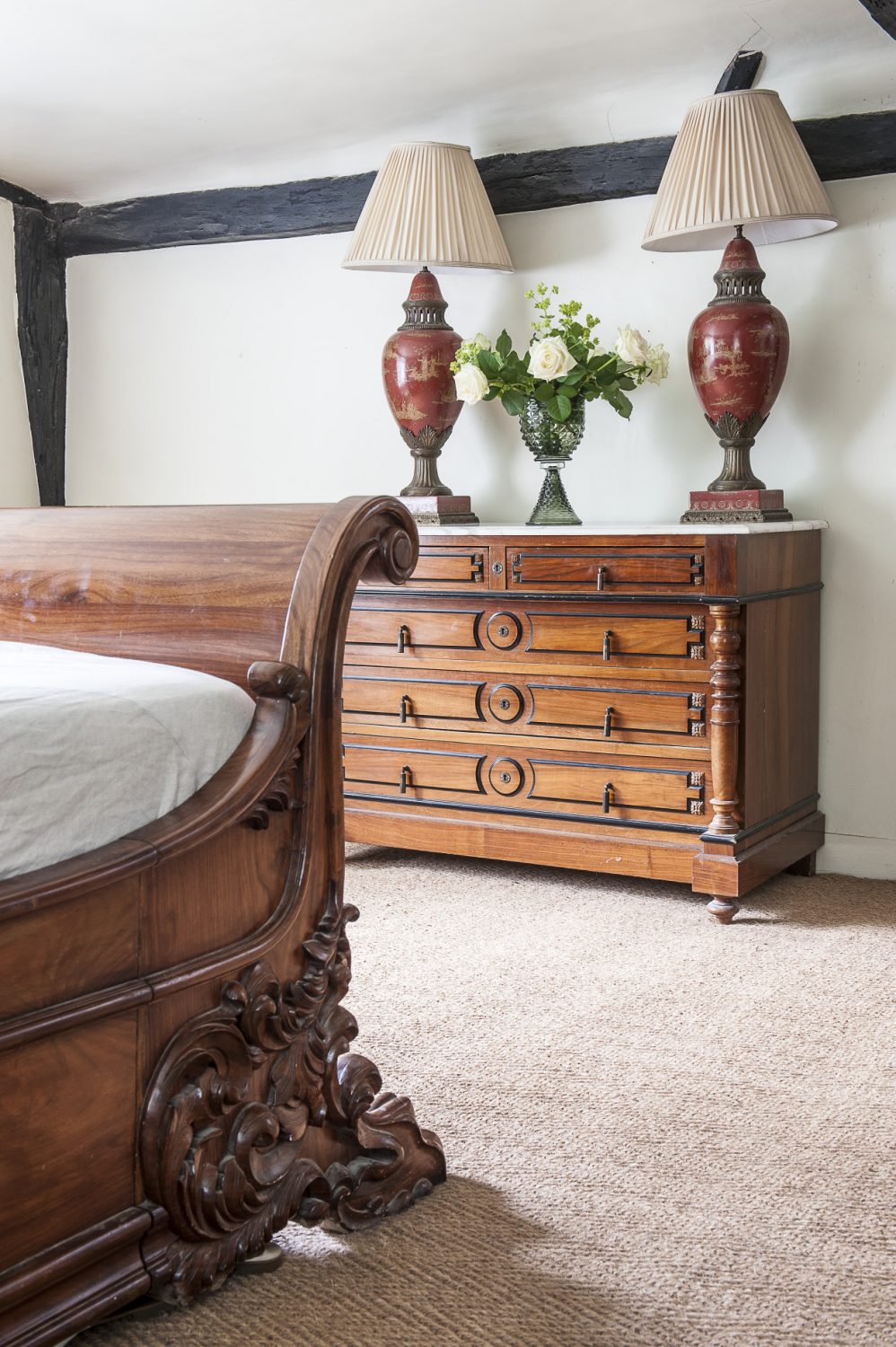 A superb marble-topped yew chest of drawers is home to a pair of Chinese table lamps from Hoopers in Tunbridge Wells