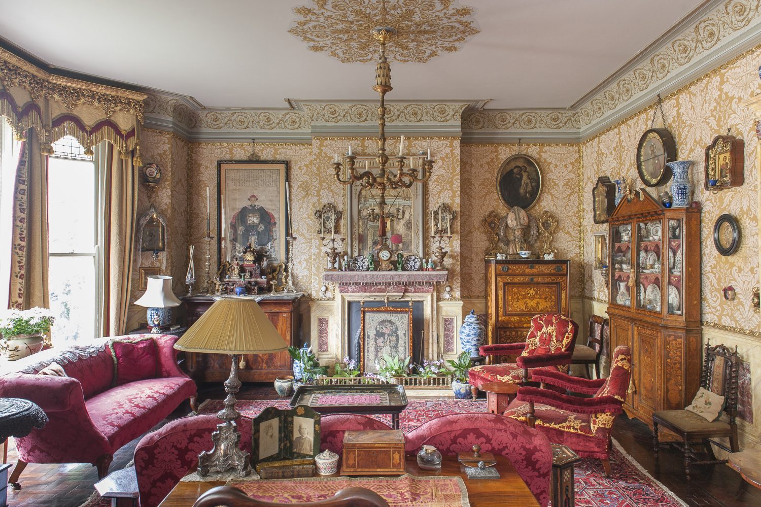The drawing room is a superb double salon with matching fireplaces at each end