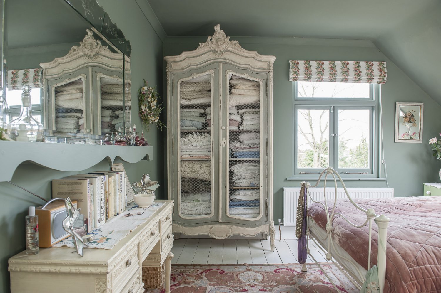 One of the bedrooms is nicknamed ‘the Flower Room’ because it is the more feminine of the two guest rooms and features various floral motifs. The delicate blind is a piece of vintage Sanderson fabric Emma found online.