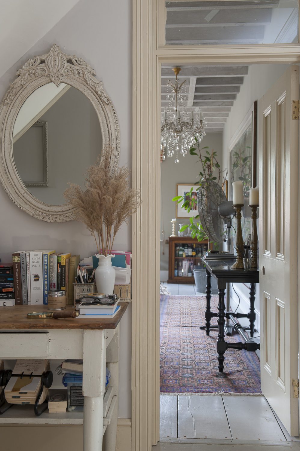 Vintage mirrors, carefully placed, are key to this light and bright home