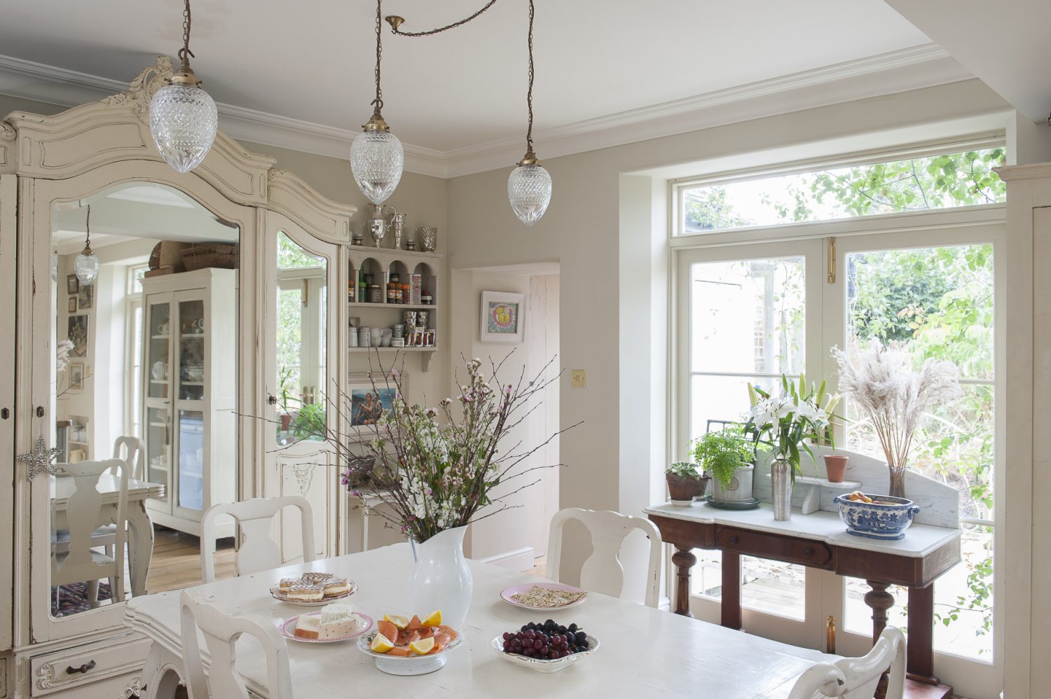 The large open-plan kitchen is a mix of French and Scandinavian style as well as being eminently practical; recycling bins are hidden under the kitchen counter and a double butler sink occupies the central island