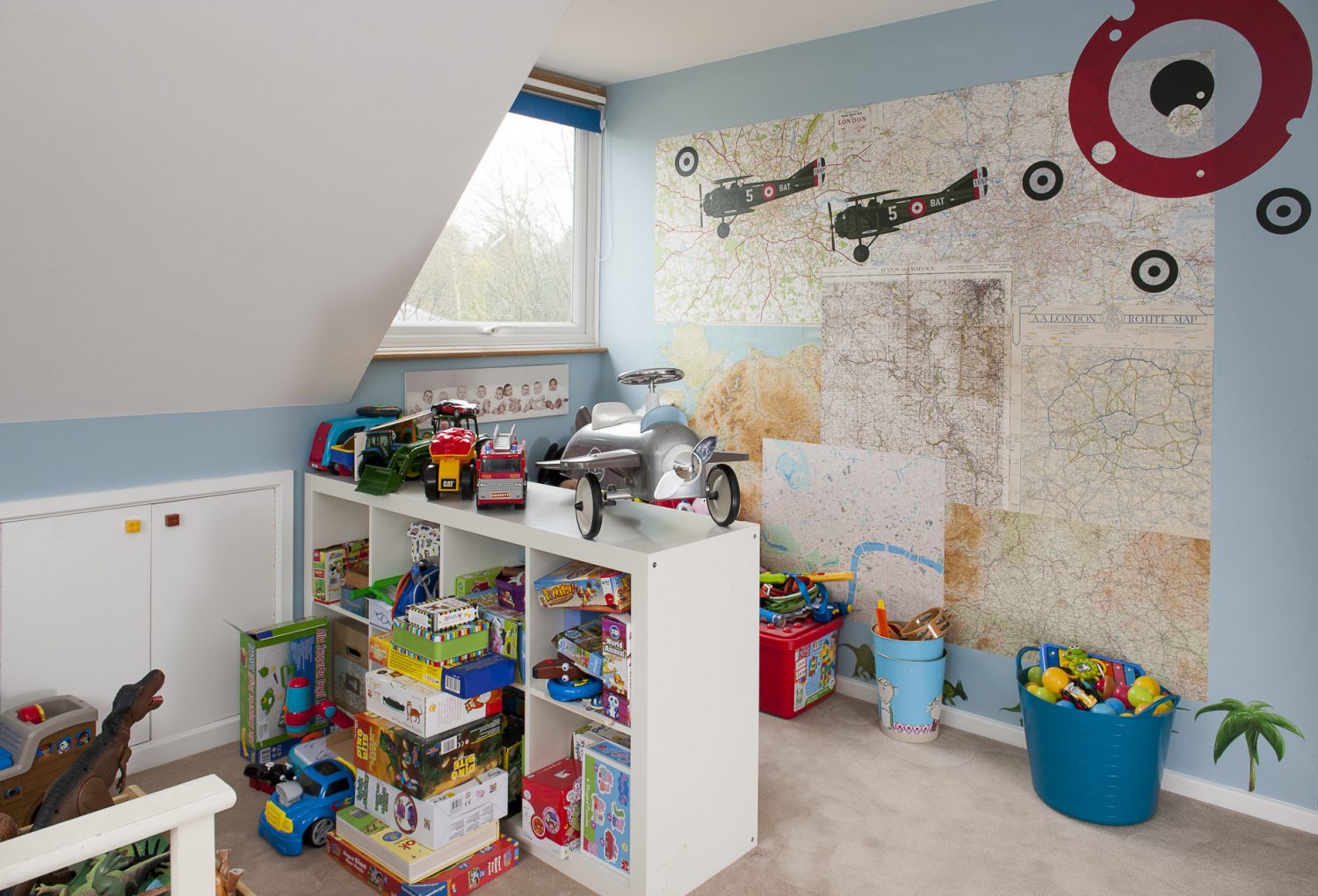Son William’s room features a wall that’s papered in old maps, sourced by Sandra from antiques shops and fairs
