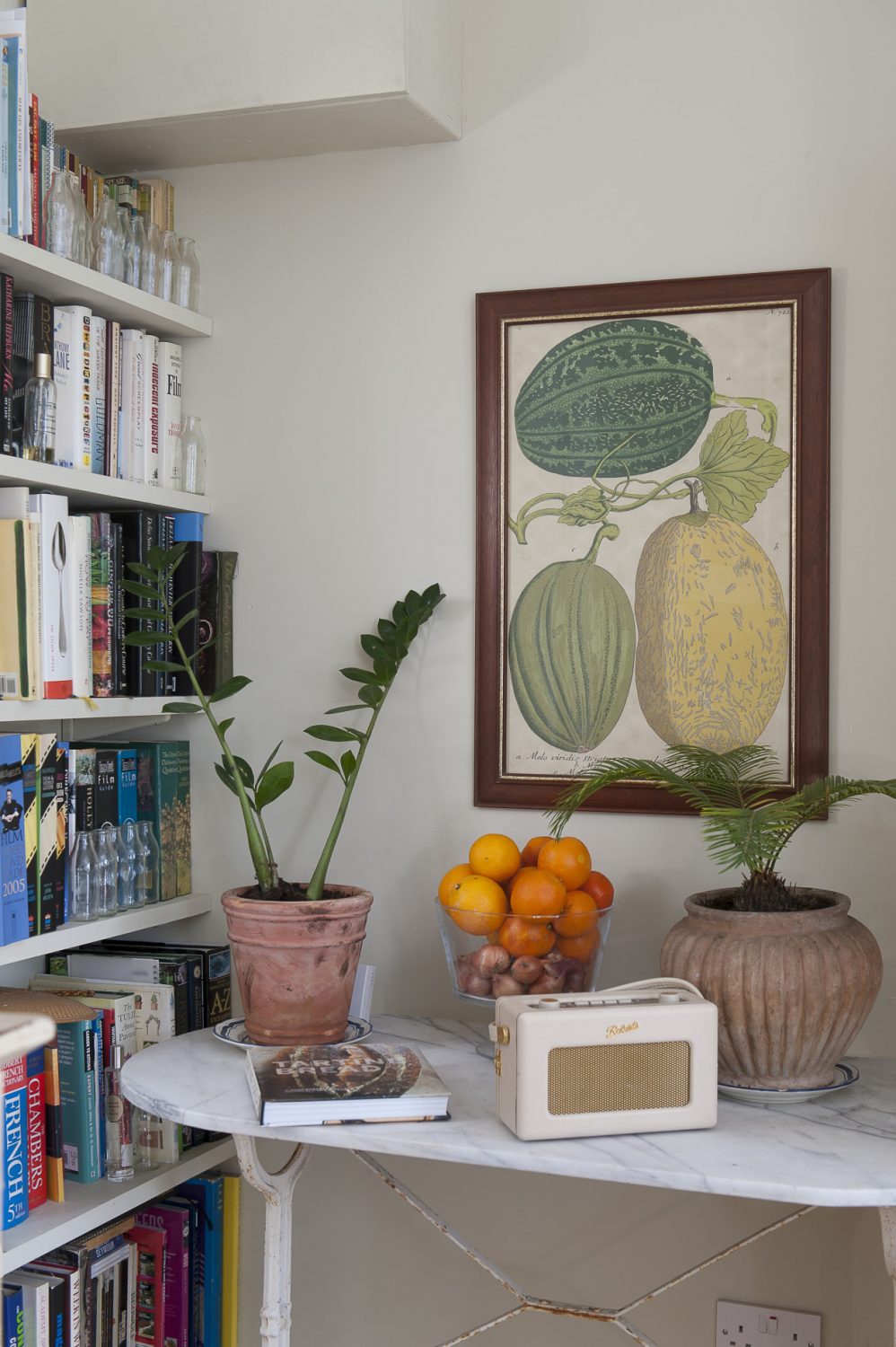 Each room includes plenty of space for books – including the kitchen. Here, recipe books sit alongside horticultural manuals and foreign dictionaries