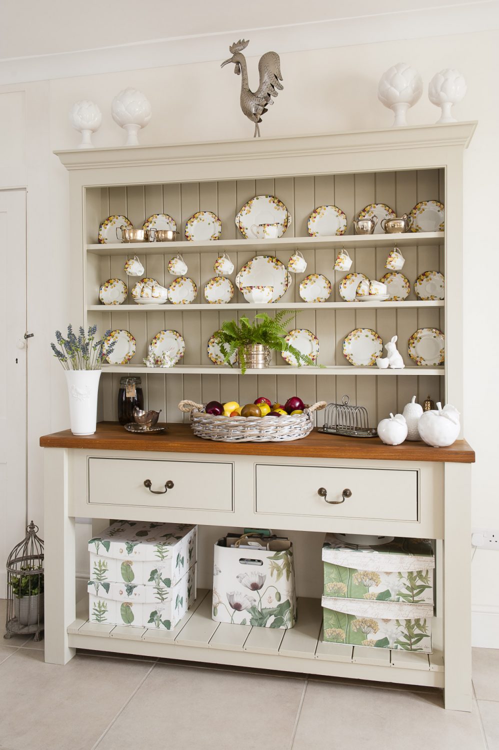 A painted Welsh dresser displays a full set of early 20th century bone china that belonged to Murielle’s parents