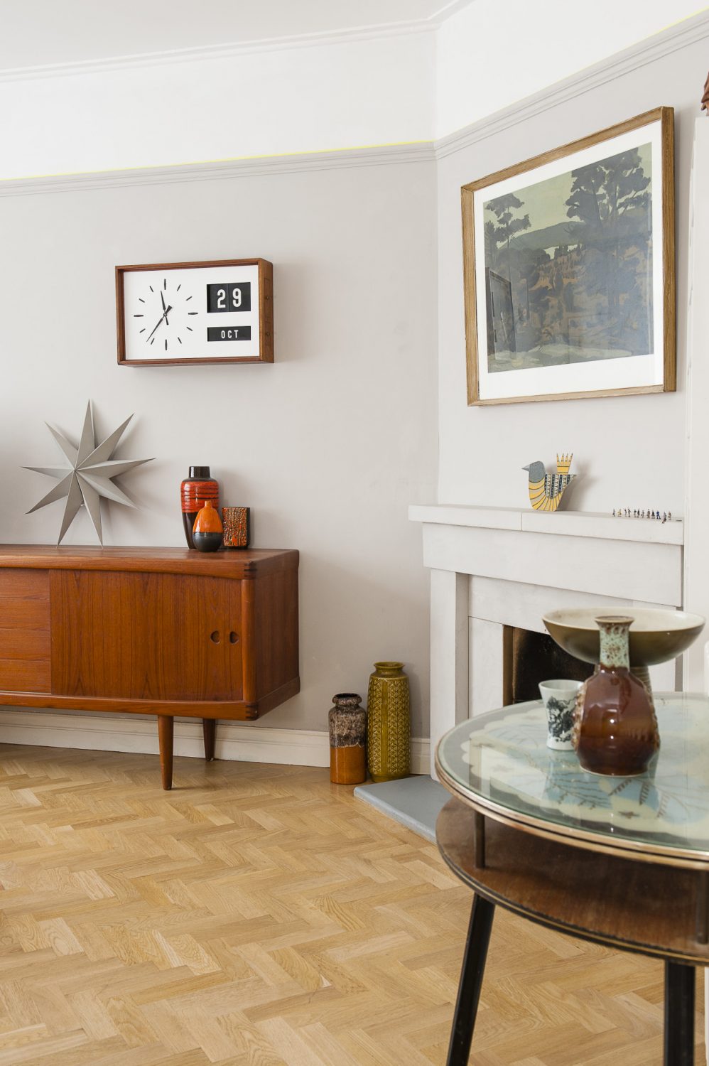 Above a spectacular mid-60s sideboard hangs a 60s bank clock showing both time and date