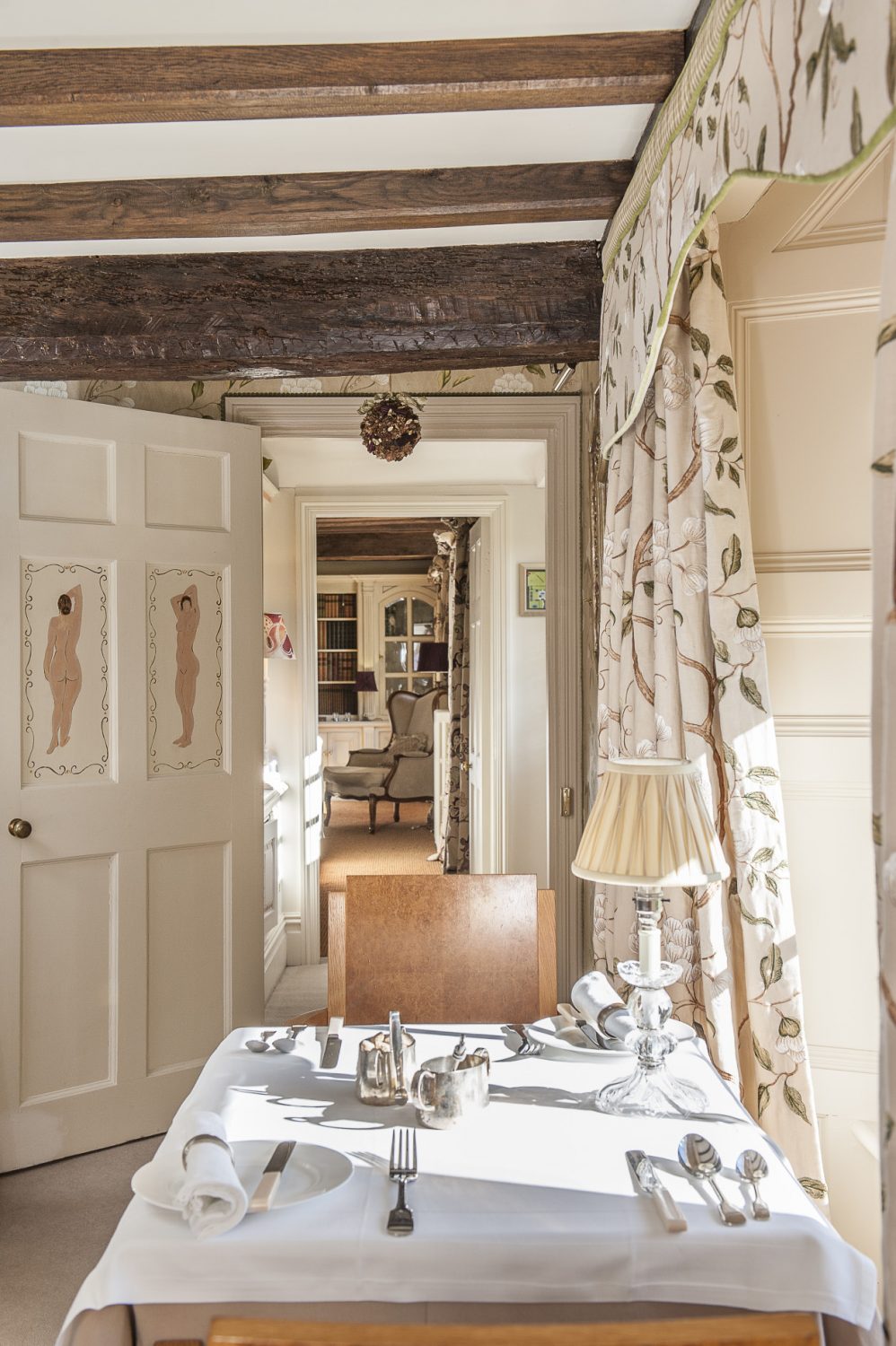 On the doors leading through to the garden and drawing room are two hand-painted nudes, Nina’s tribute to Charleston
