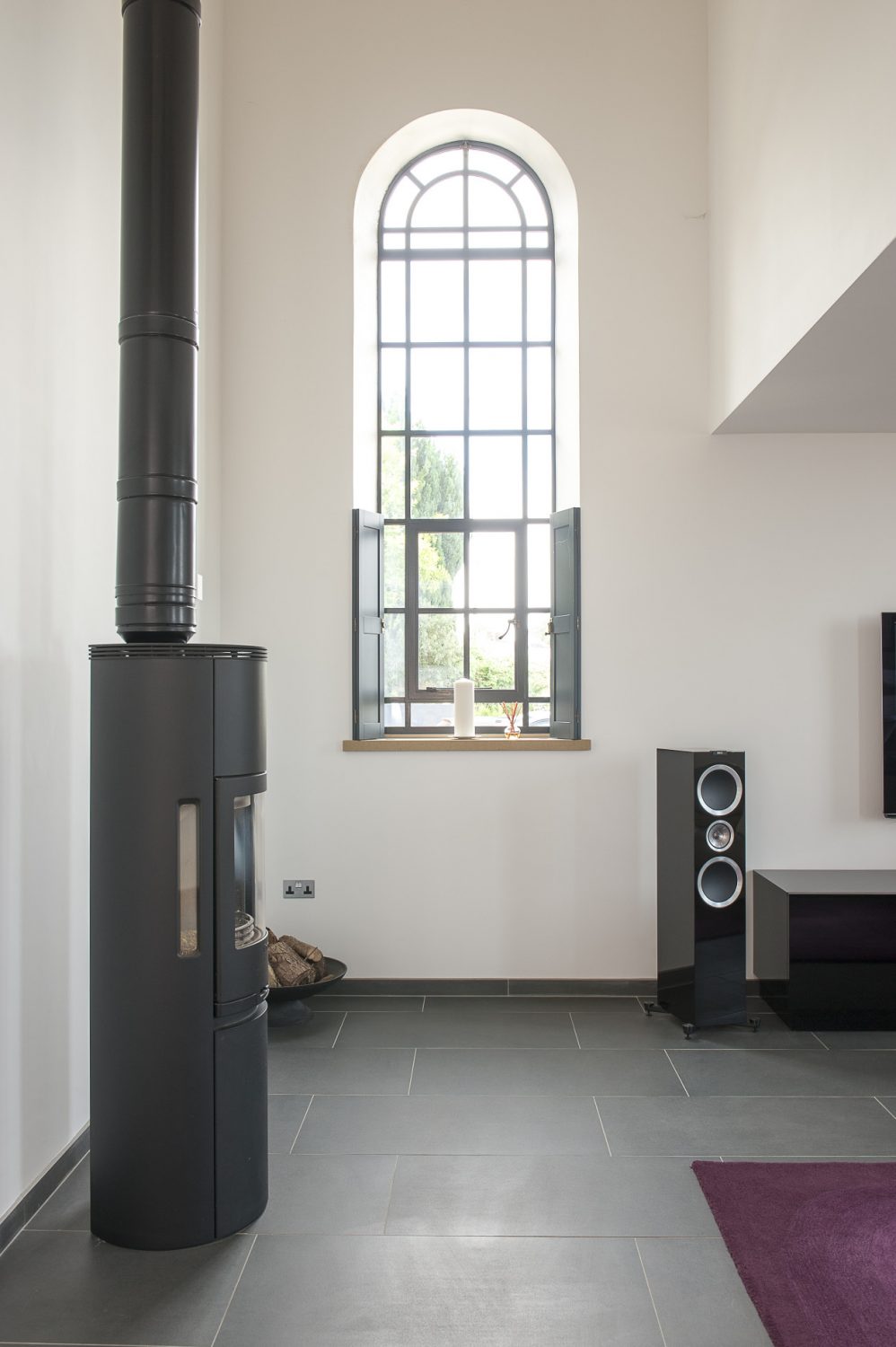 At one end of the room is a contemporary Contura woodburner, the tallest that Nick and Sonja could find