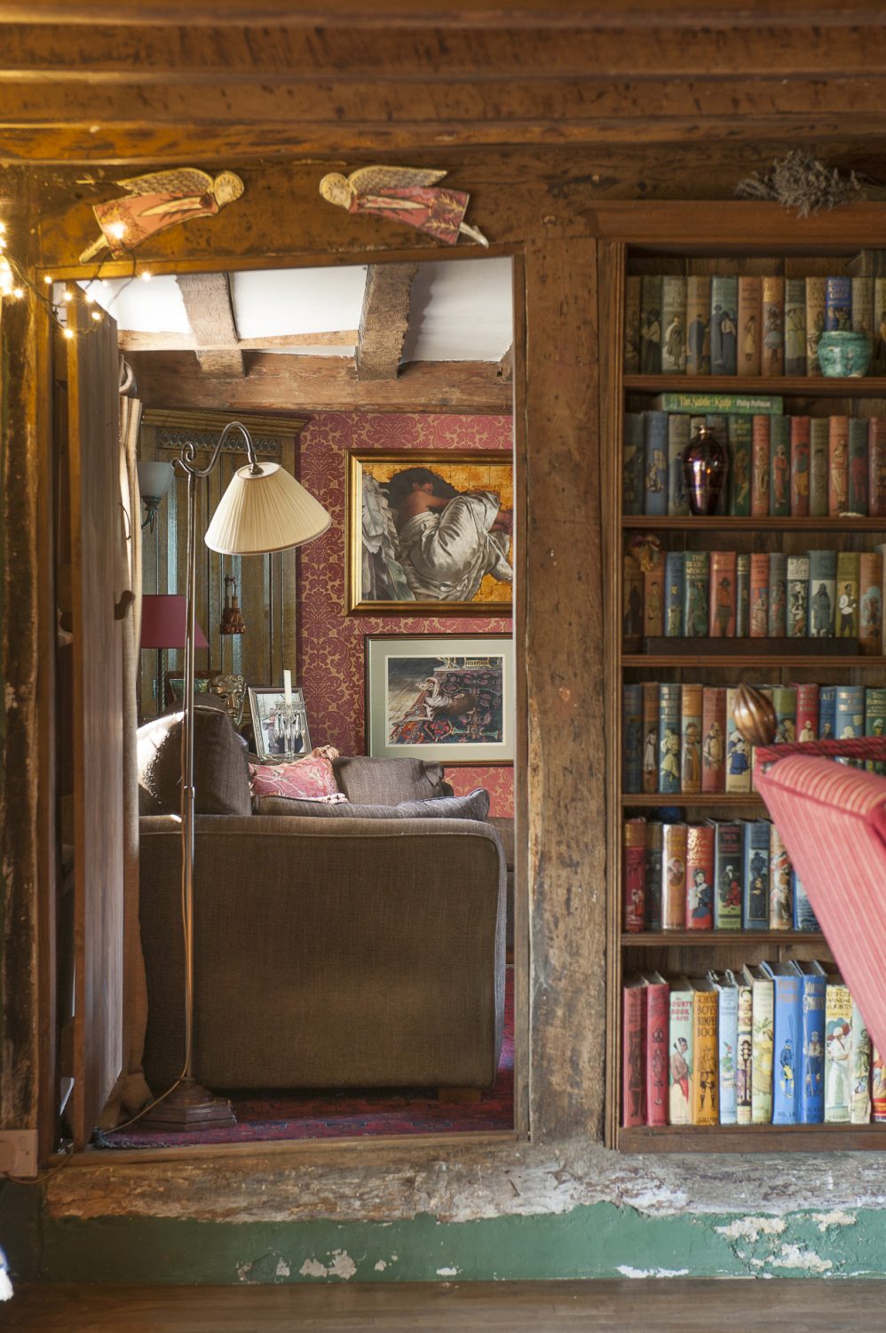 Instead of wallpaper depicting the spines of books, Tim and Eve have a wall of children’s books dating from the First World War to the mid 1950s