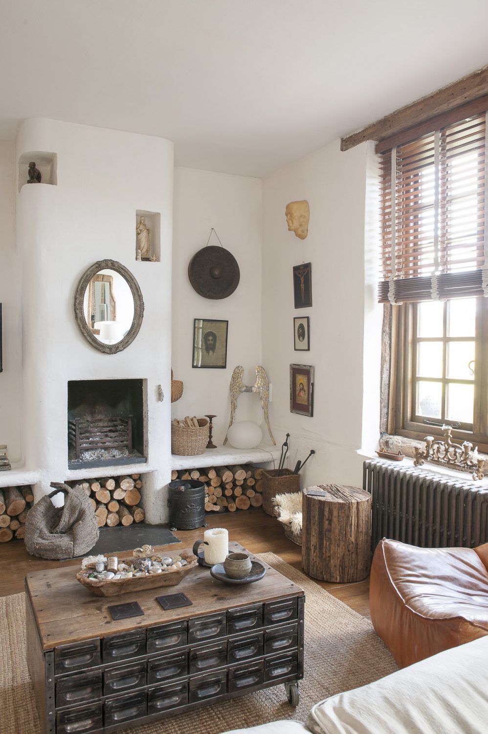 A cosy seating area gathers around a white Moorish fireplace and chimney
