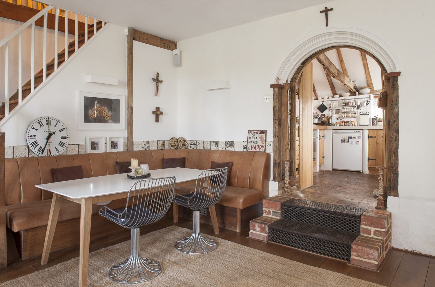 The family/breakfast room divided by a structural beam supported by one of the cast iron pillars that once held up a roof in Tenterden’s Victorian railway station