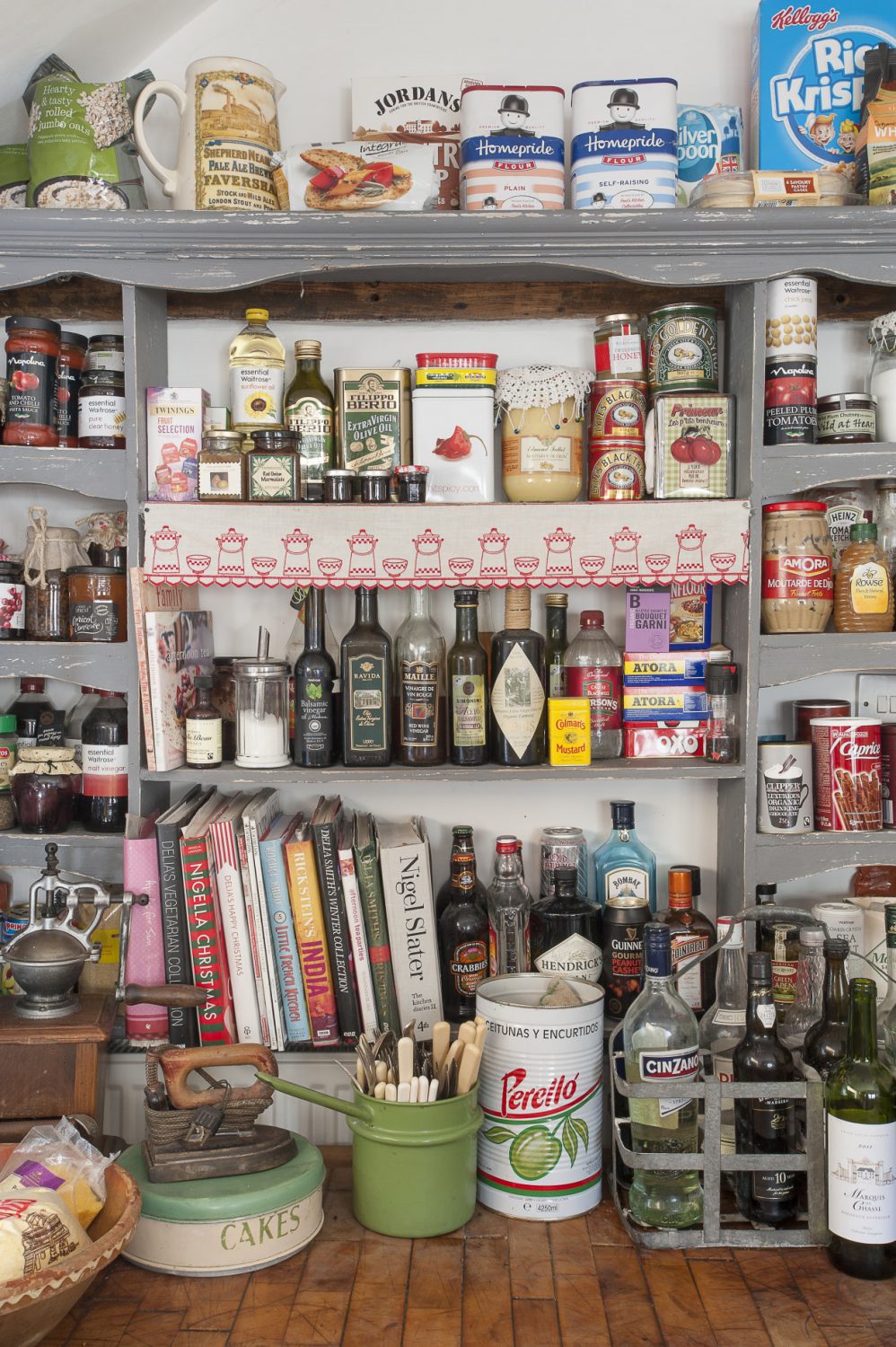 generously stocked shelves ensure that ingredients and cookbooks are always conveniently to hand