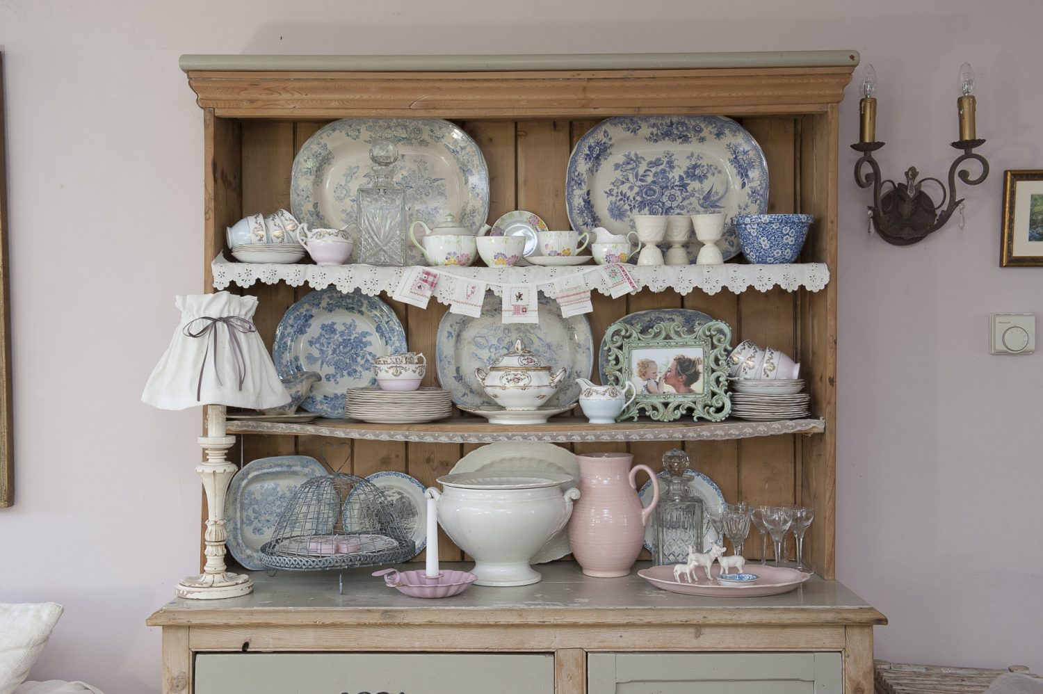 A collection of pretty crockery on a farmhouse dresser completes the look in the living room