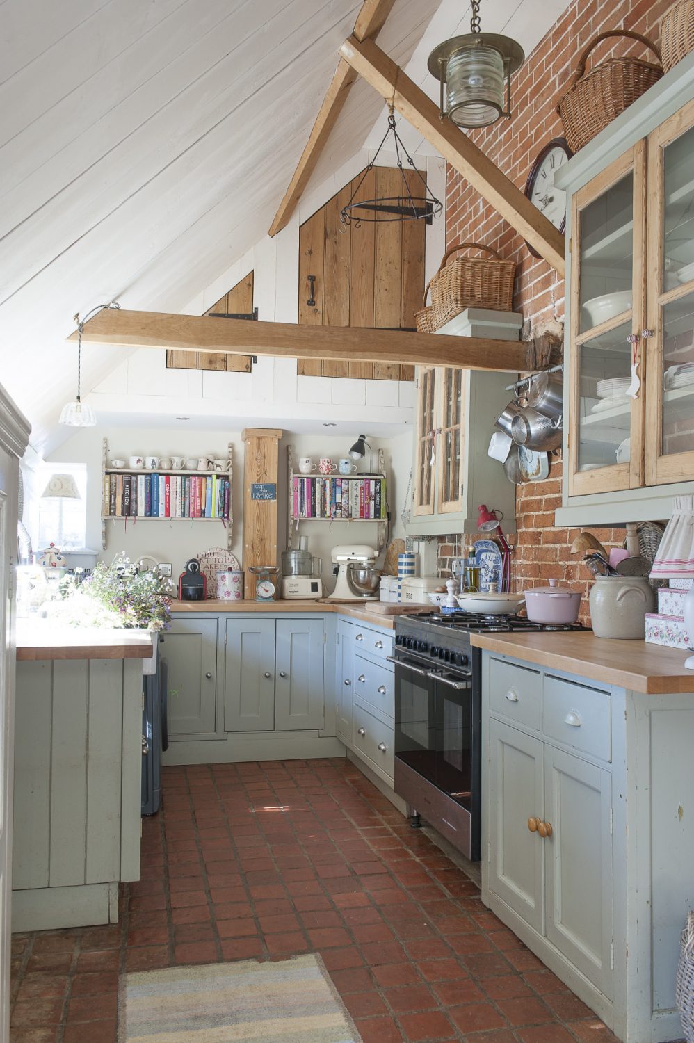 The kitchen sits under the catslide roof at the back of the farmhouse and is made from a host of up-cycled and recycled materials
