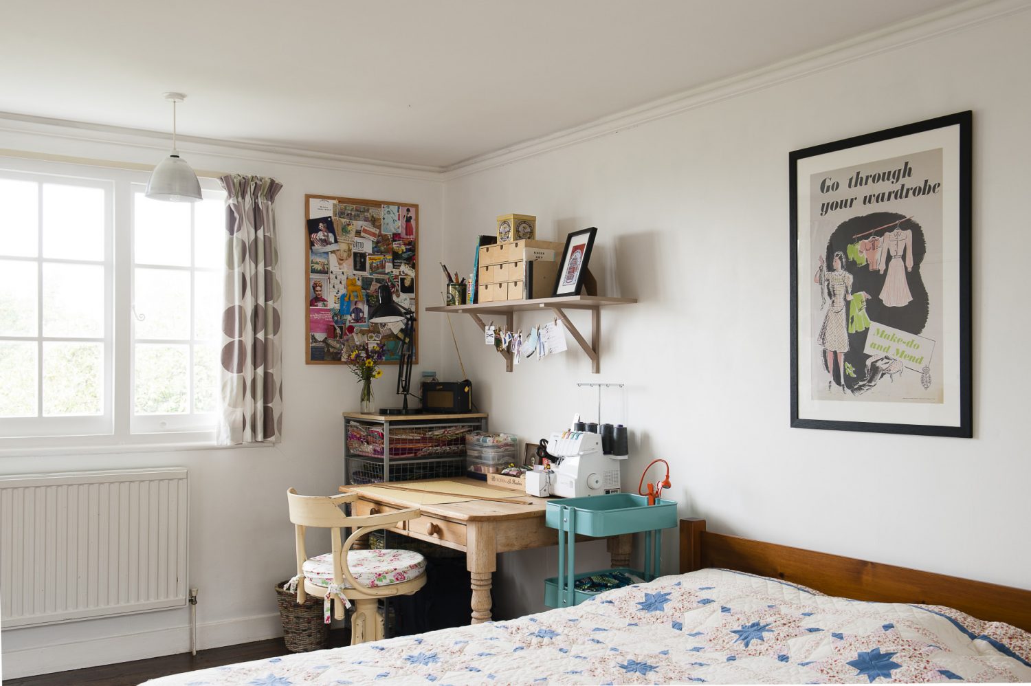 A vintage ‘Make do and Mend’ poster decorates the spare bedroom, and sits above the homemade quilt and alongside Claire’s much-used sewing area
