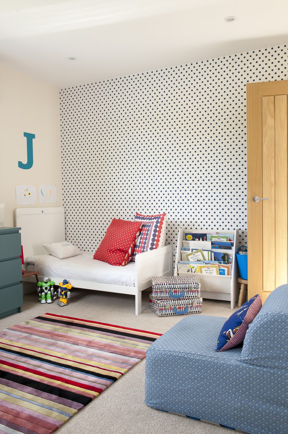 Jenny has papered the twins’ room with navy polka dots