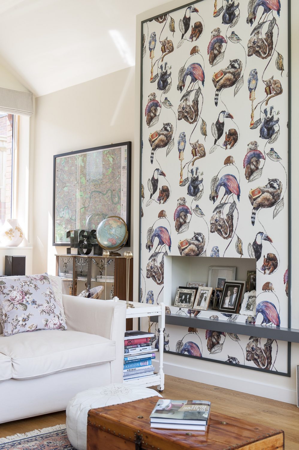 The chimney breast papered entirely in House of Hackney ‘Empire’ features a variety of critters enjoying themselves, among them a hookah-smoking sloth, a frog in a bowler hat, a fanning otter and an imbibing badger
