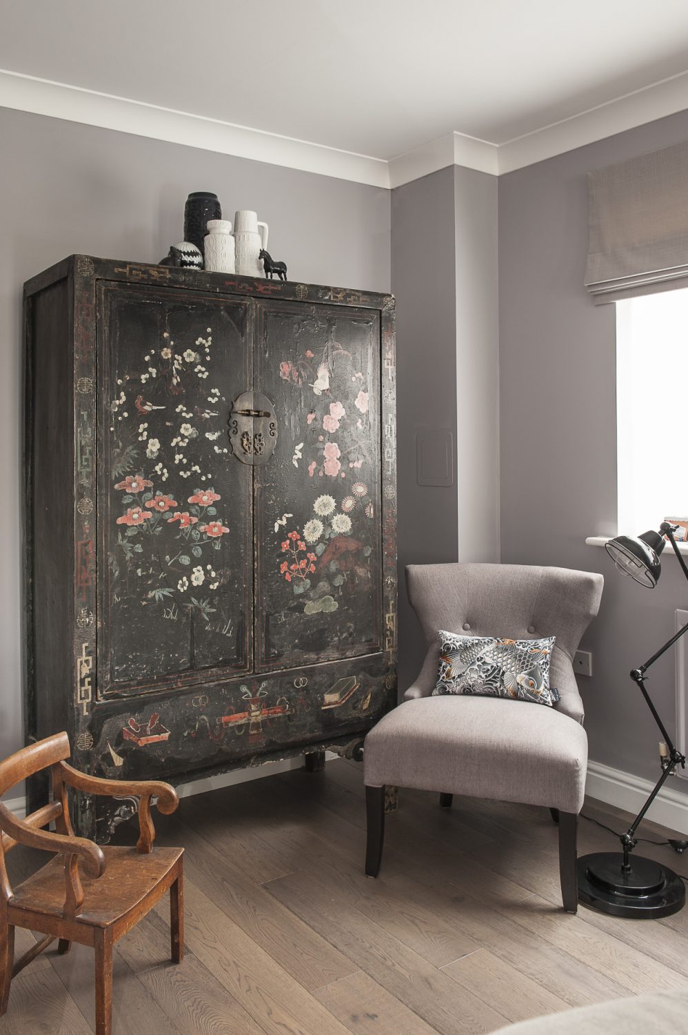Phoebe has created a clever juxtaposition of textures, designs and patterns from inlaid chairs and an oriental cupboard to a sequinned Jean Paul Gaultier cushion