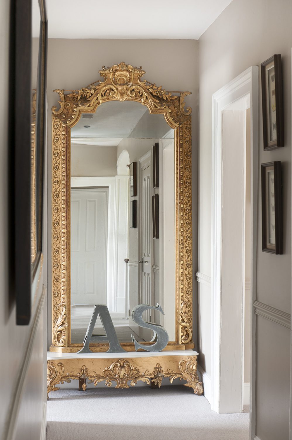 A huge, more-than-full-length mirror takes pride of place on the upstairs landing, reflecting the natural light which floods into the bedrooms through traditional sash windows