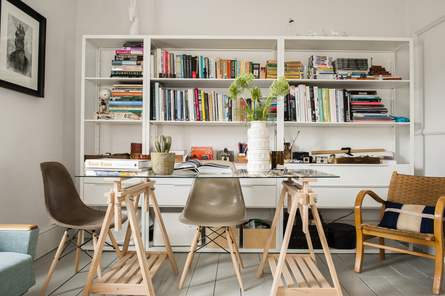 The bookcase and glass-topped desk