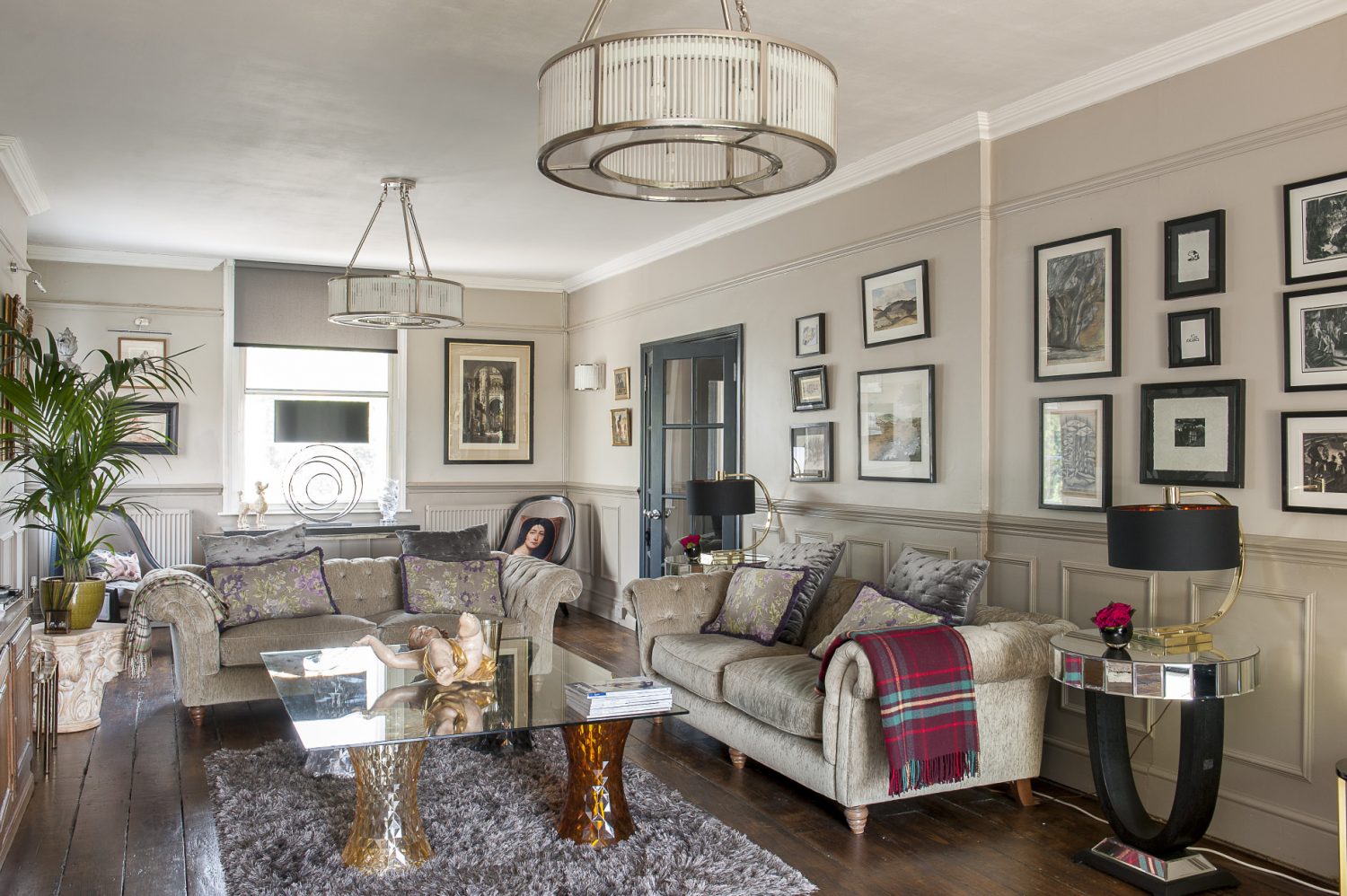 The drawing room contains matching French Deco wall and ceiling lights from WBR Interiors, a favourite shop on Wandsworth Bridge Road. Underneath is a coffee table constructed from a sheet of glass atop four Kartell Stone stools
