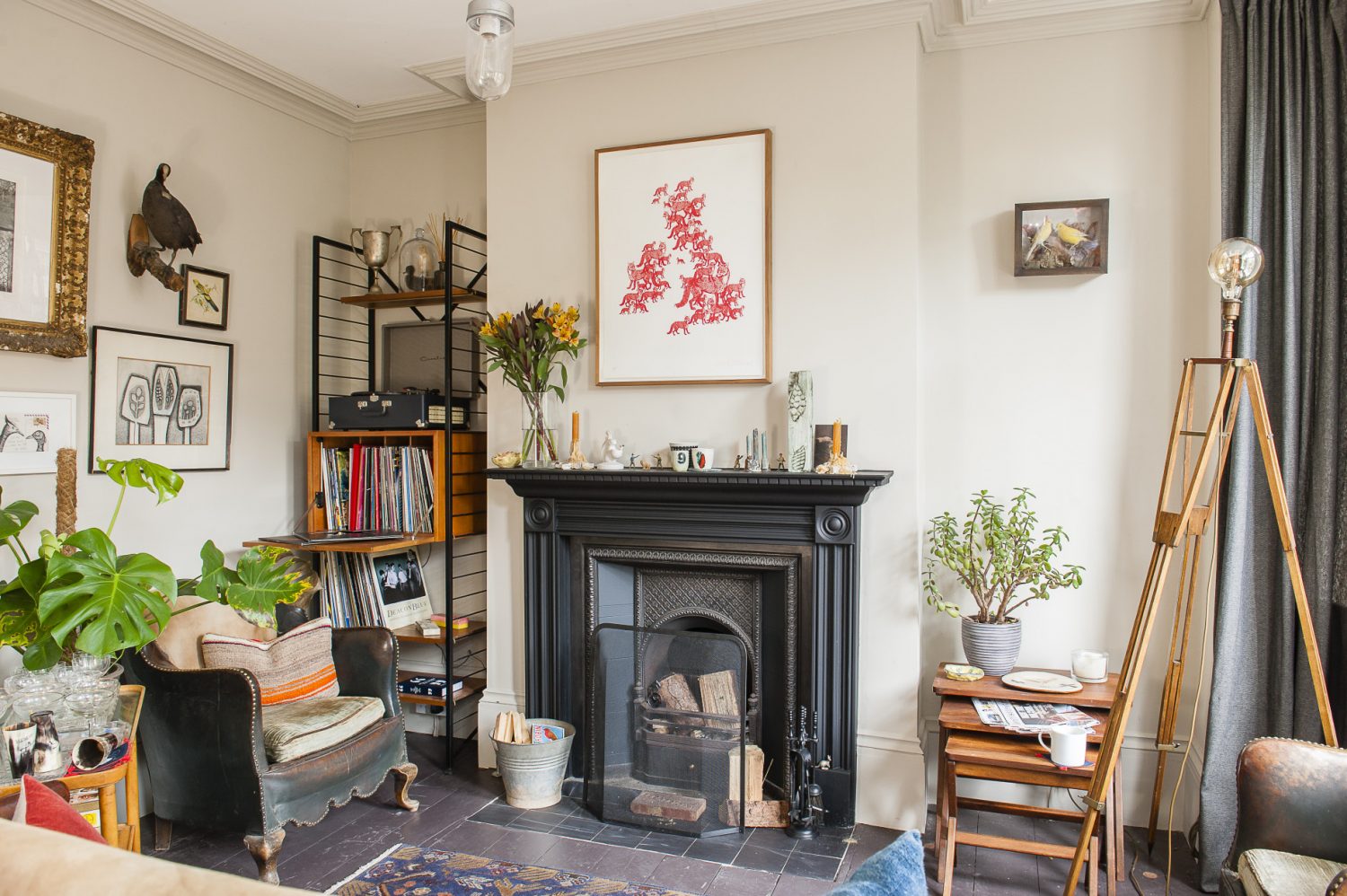 Above the fireplace in the living room hangs a UK map made out of foxes by artist Patrick Thomas. The ceramics on the mantelpiece are from The Clay Den in Hastings