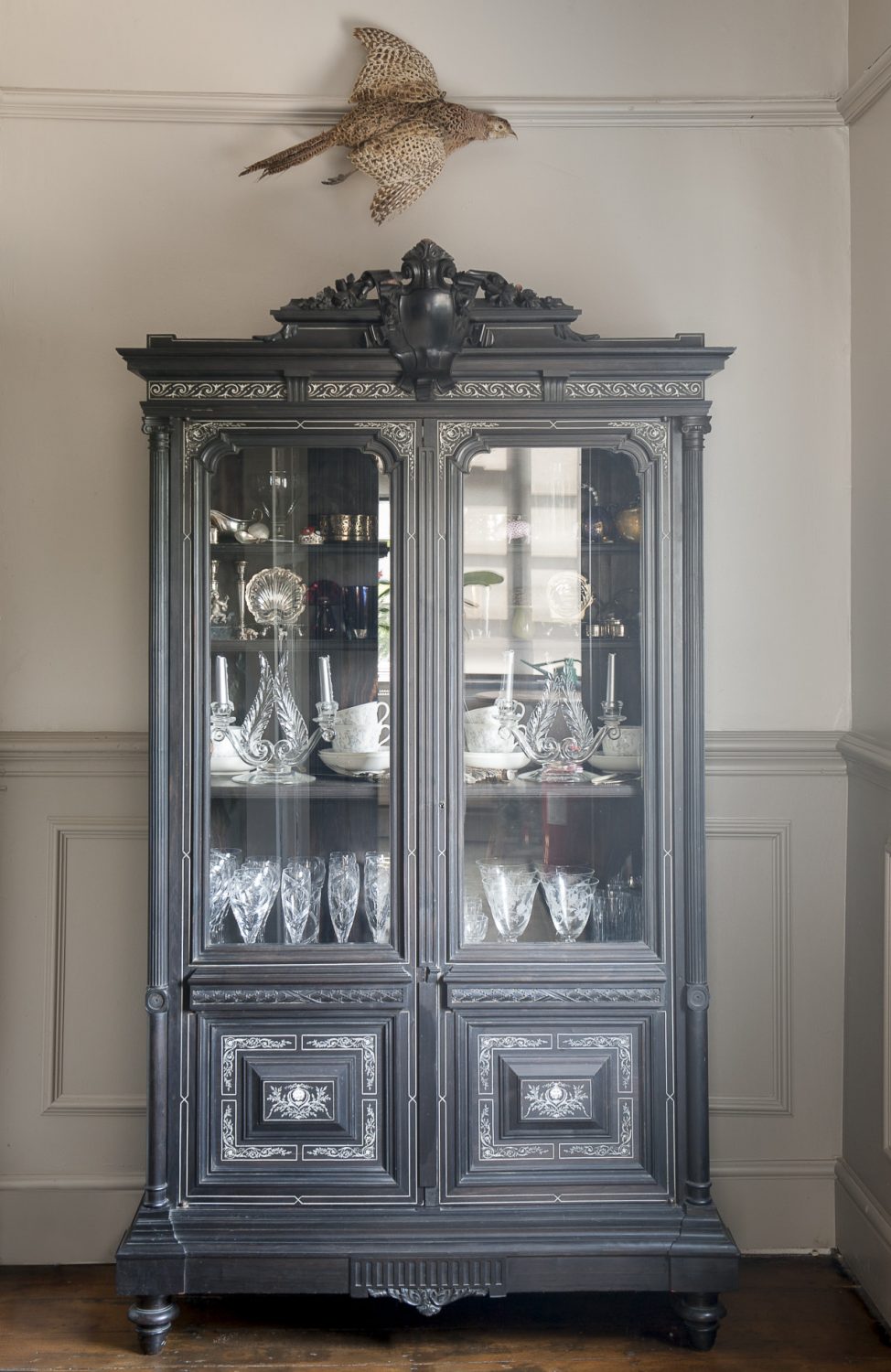 A glass-fronted ebonite cabinet was bought for ‘virtually nothing’ from Bentley’s auction in Cranbrook. Taxidermy dotted around the home is a reminder of its former life as a country pub and coaching inn