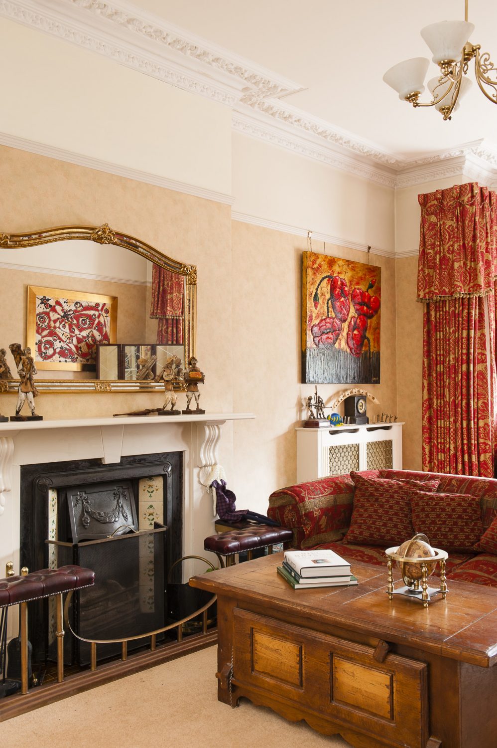 Sofas gather around the fire in the family drawing room