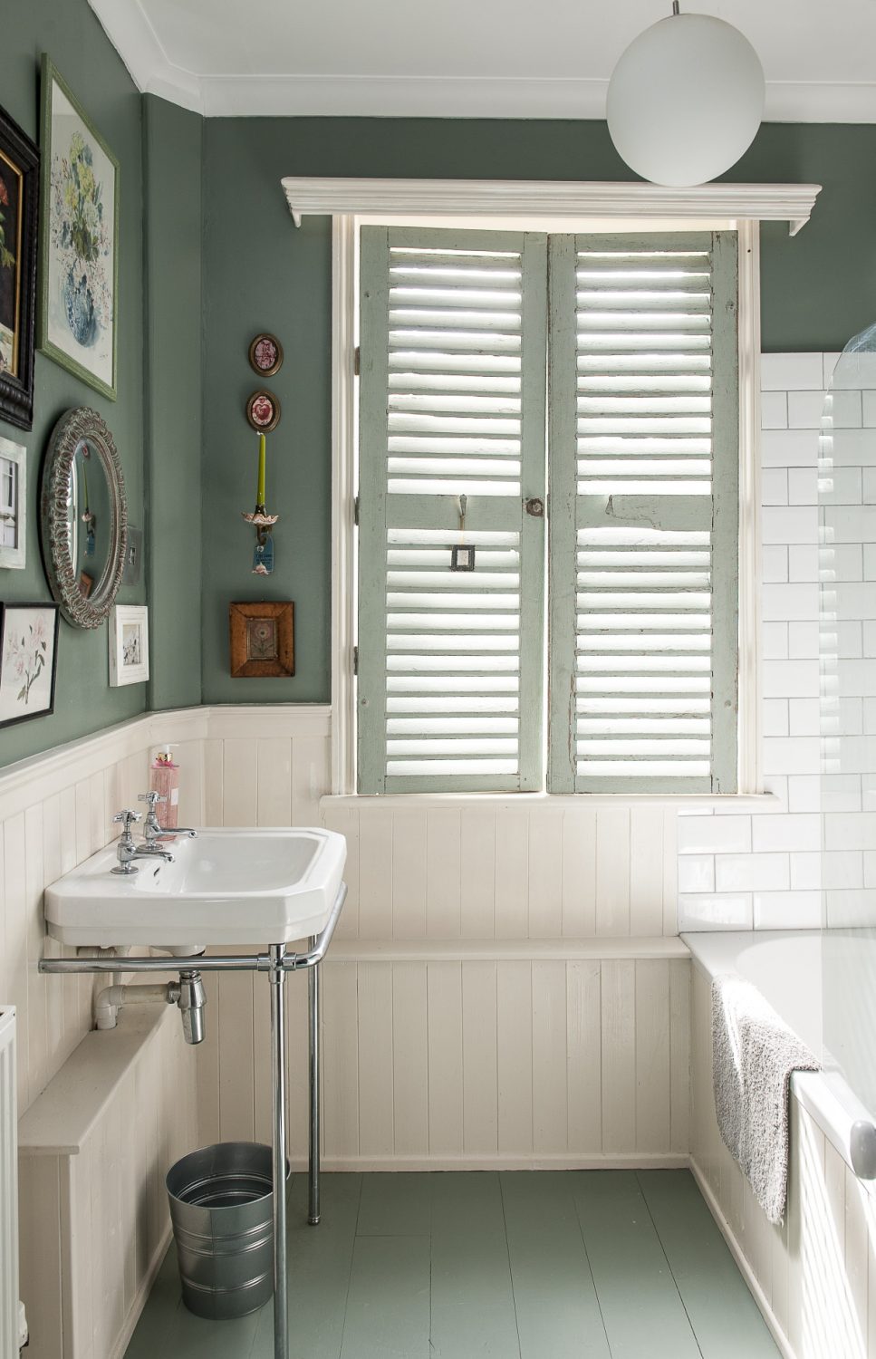 On the first floor, the family bathroom and loo are painted a mossy green and nautical blue, lined with off-white wood panelling