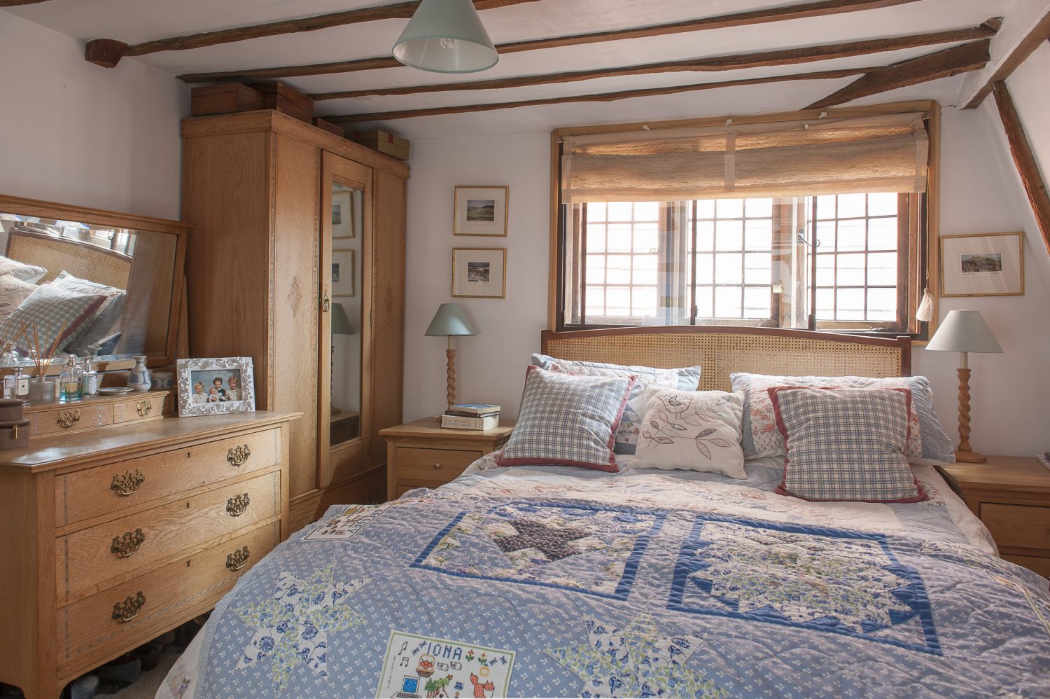 The master bedroom with its heirloom quilt made by Suzanne for her mother’s 70th birthday