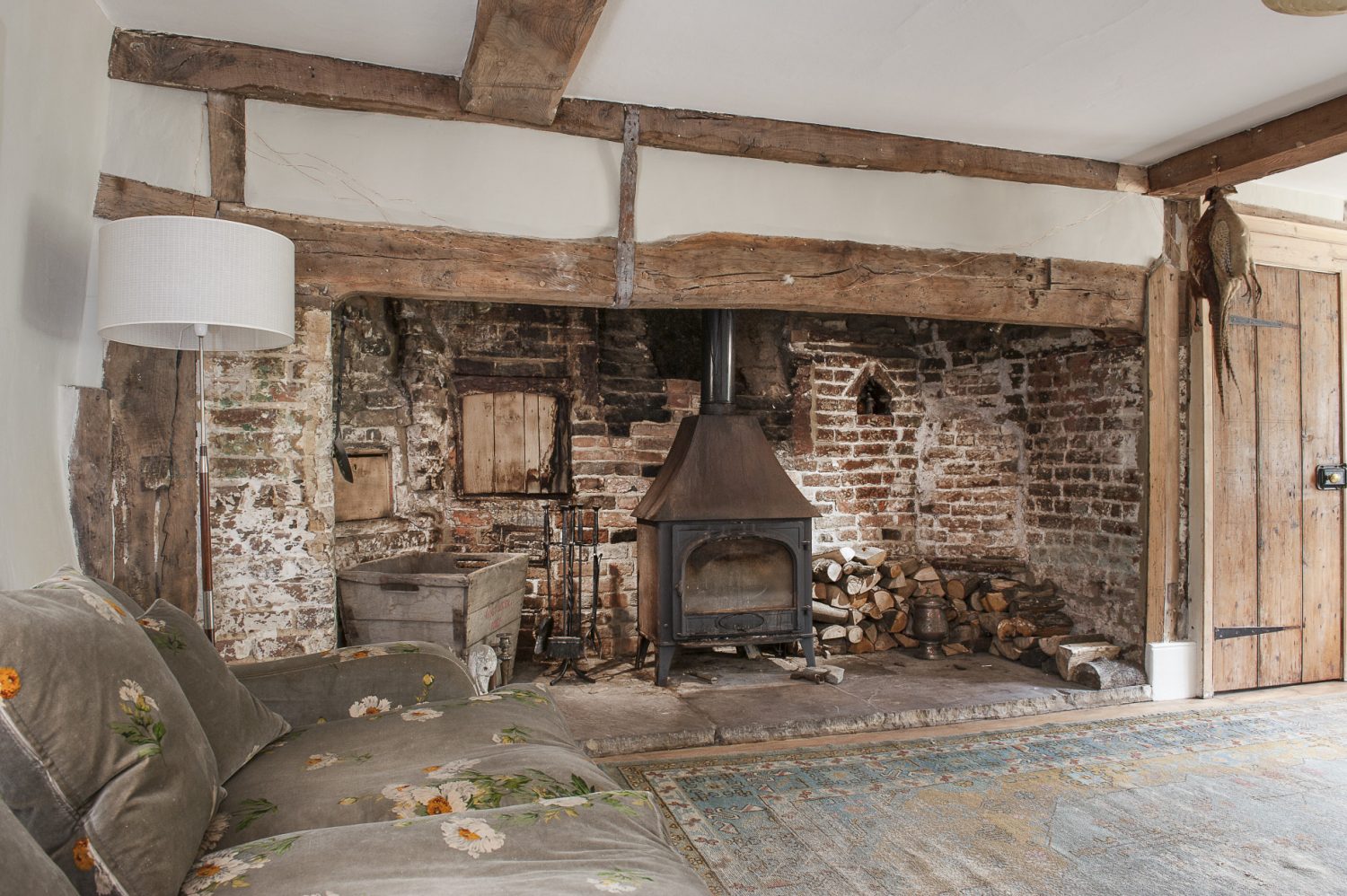 The heavily beamed 16th century drawing room is home to a huge inglenook, complete with bread oven, that extends two thirds of the length of the room