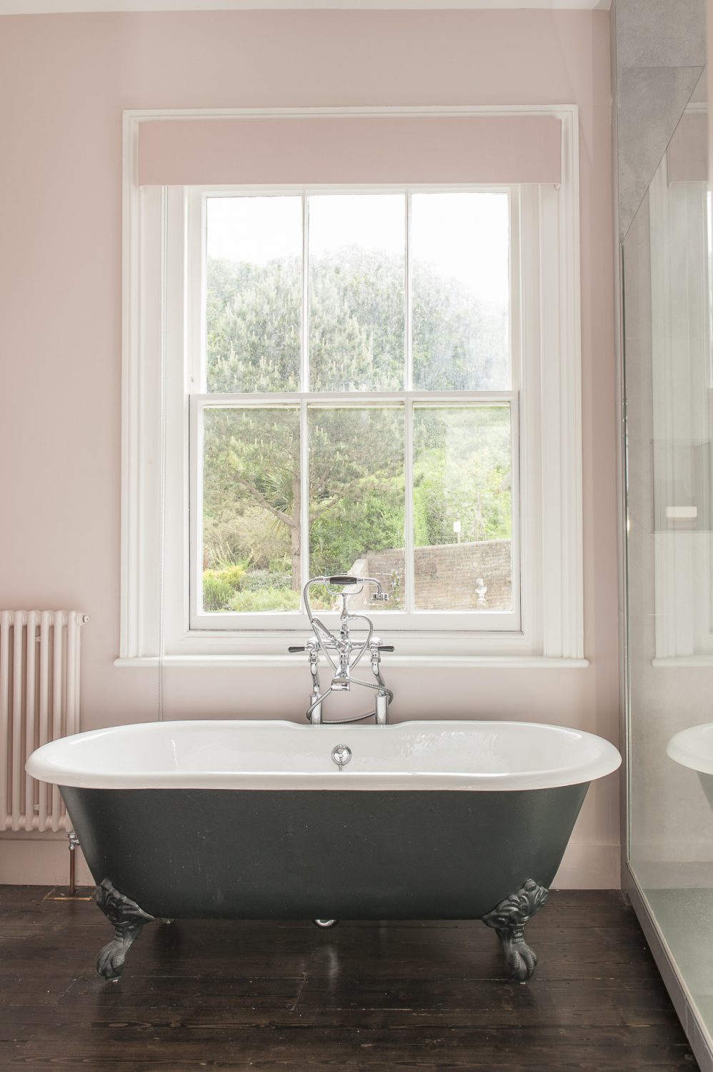 There is an equally lovely view from the bath - over a planted sedum flat roof and their neighbour’s beautiful garden, up to Hastings Country Park. The bathroom fittings are from CP Hart