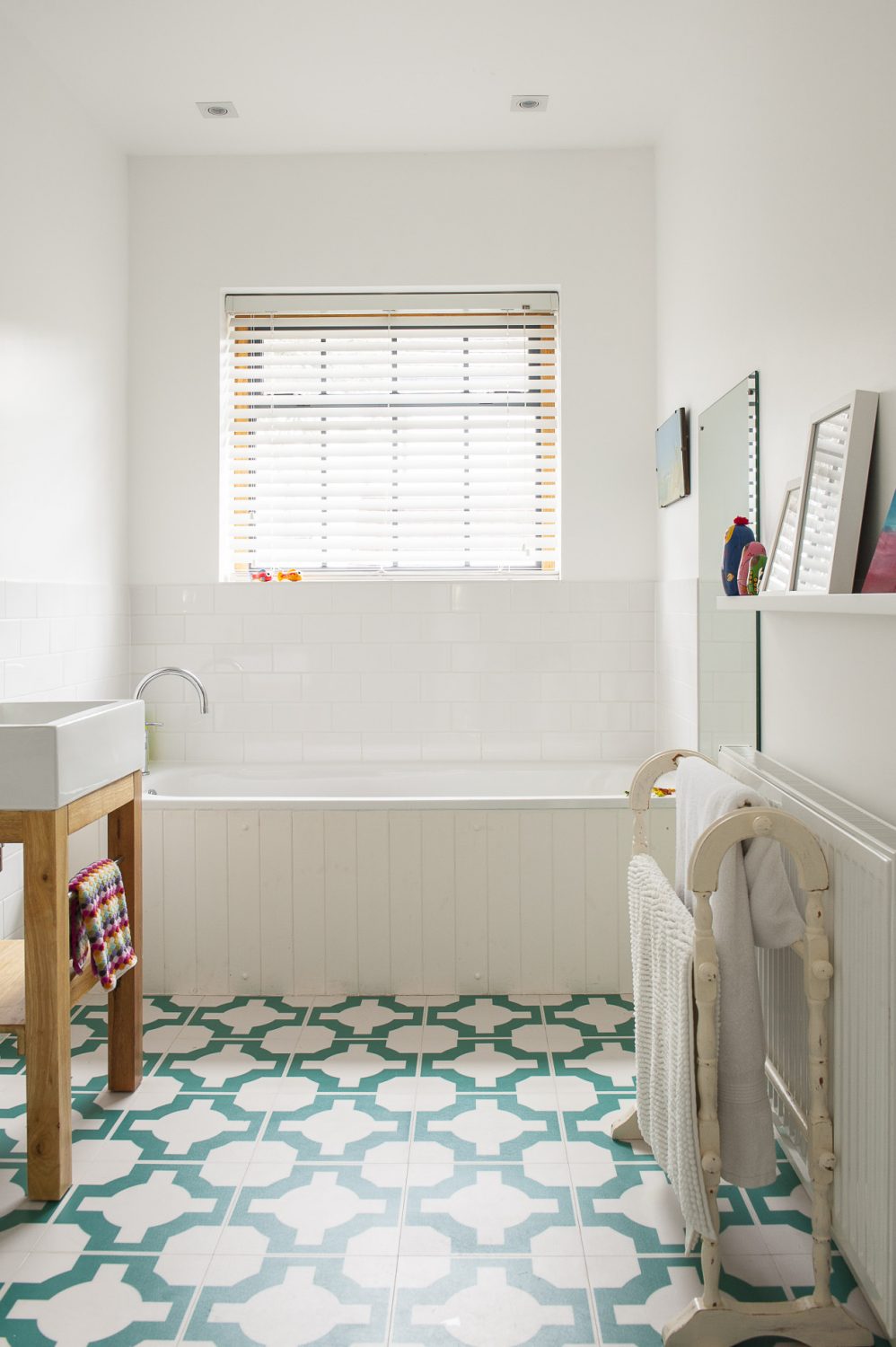 The simple bathroom manages to be both stylish and functional