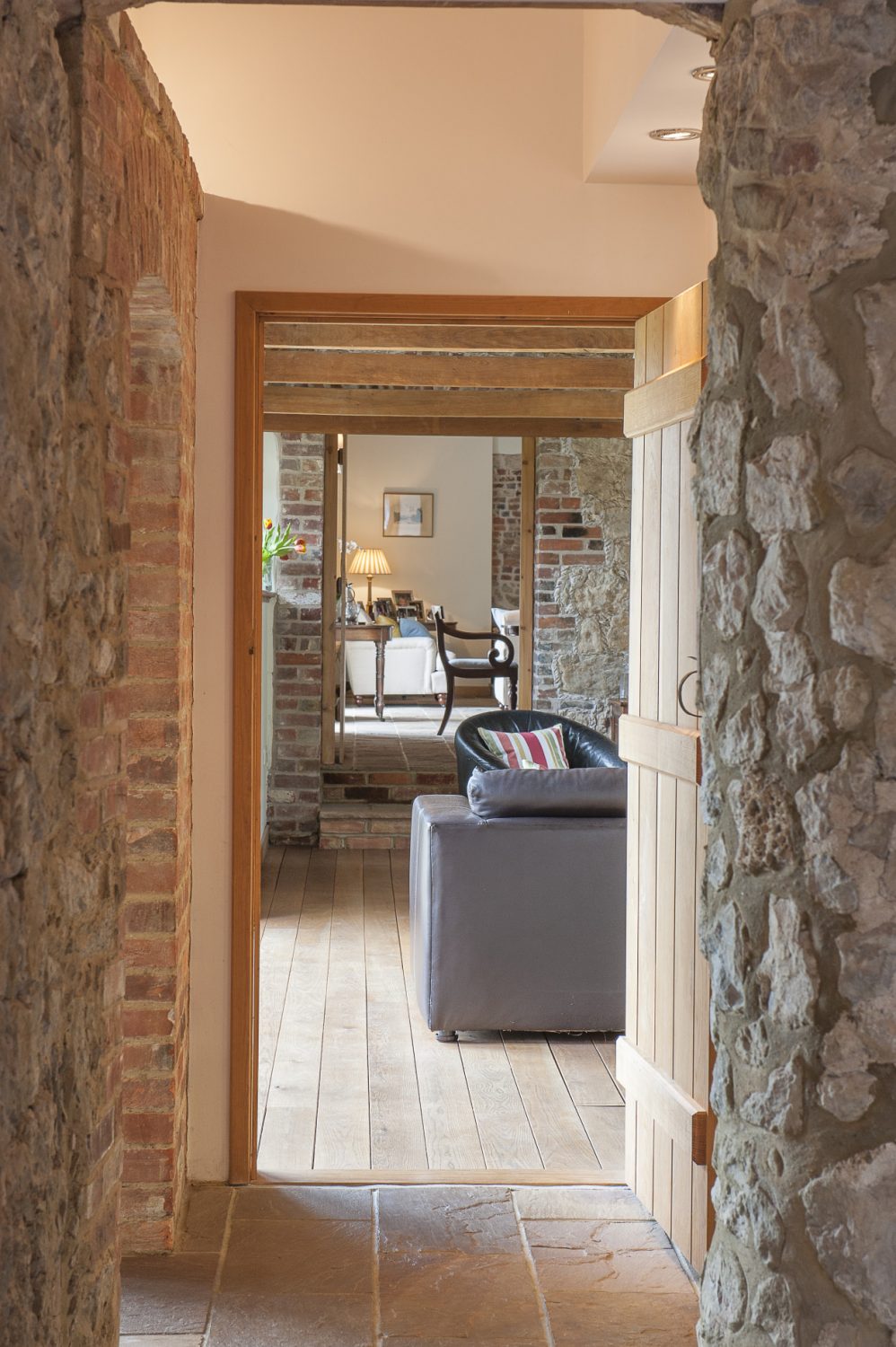 Perpendicular to the kitchen, a short corridor leads to the sitting and dining room
