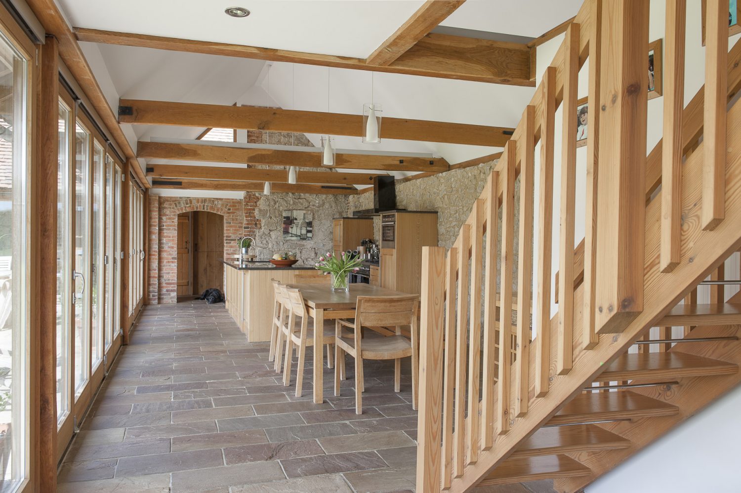 A wonderful vaulted kitchen/dining room lies at the heart of the house. Three walls are of exposed ragstone and the fourth composed of three sets of bi-folding doors that open into the garden