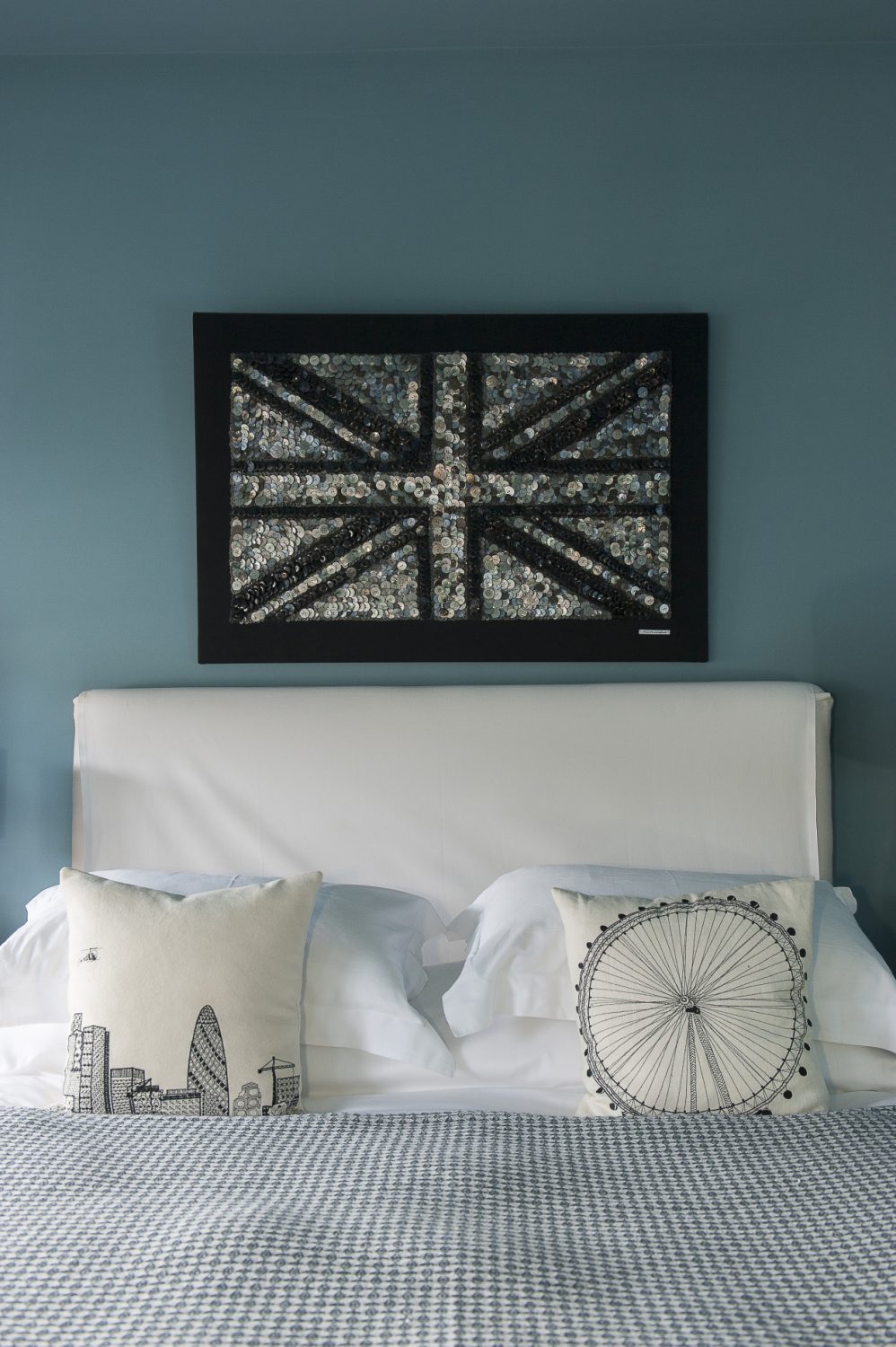 An Ann Carrington original, this time of a Union Jack, hangs above the bed.