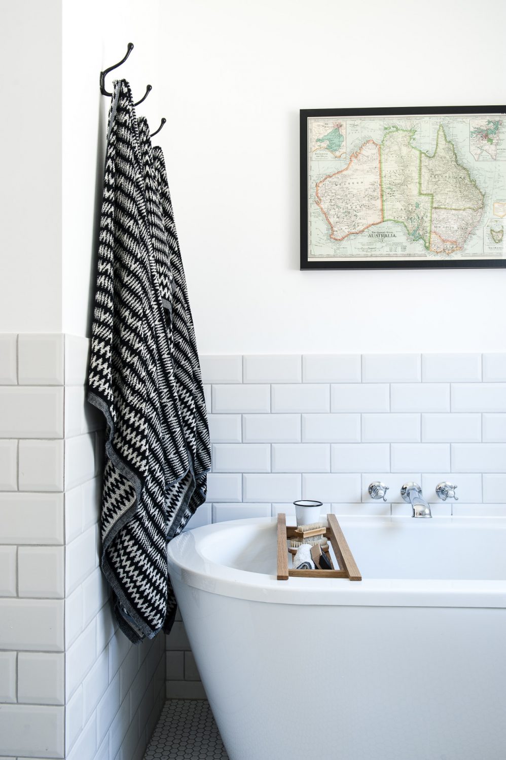 The bath in the ground floor master bathroom is from Patons of Walton and the black and white towels are from House of Fraser. The map of Australia is a piece of wrapping paper from Willow & Stone, which Jenna had framed