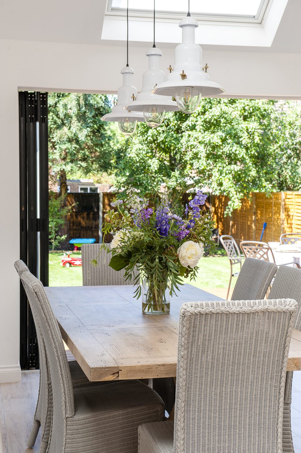 Bi-fold doors open the entire back of the house onto the garden
