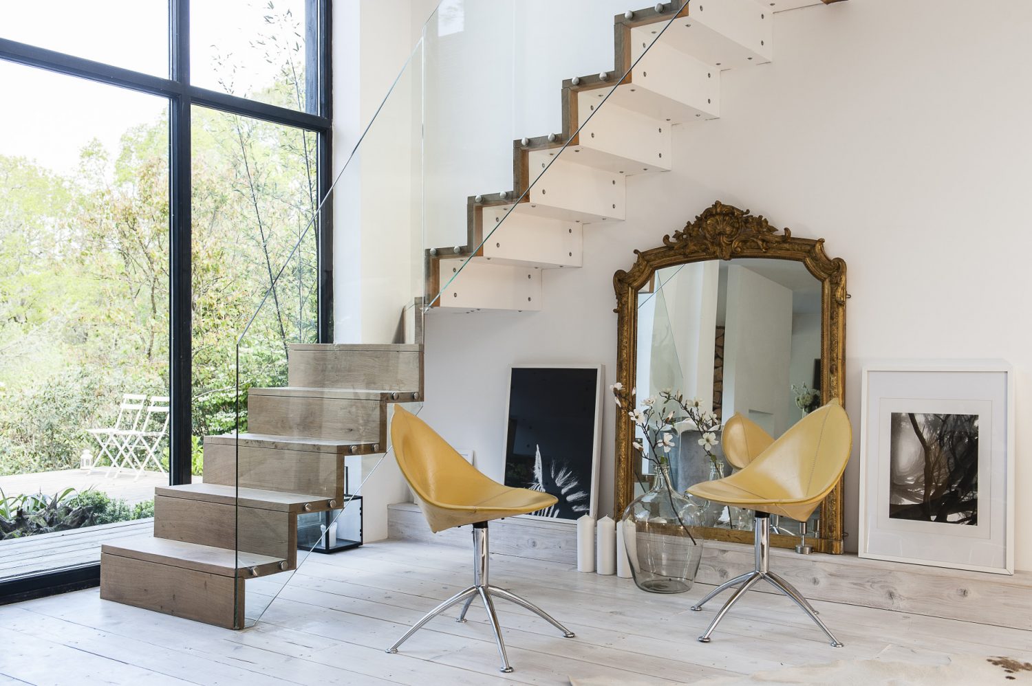 Designed by Sue together with Roy, a talented steel fabricator, the staircase is crafted from steel and encased in green oak with glass balustrading