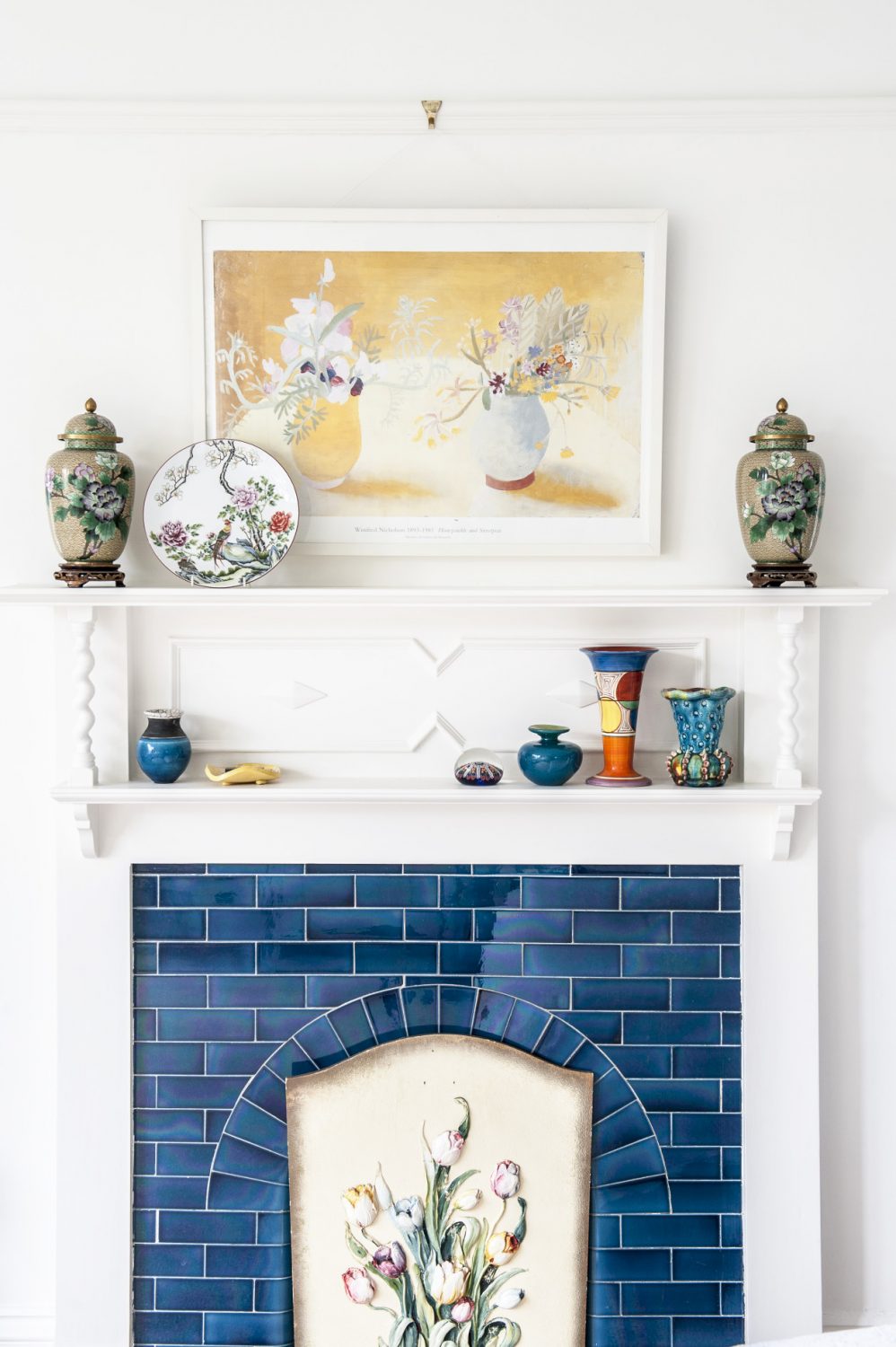 The tiled fireplace in the master bedroom