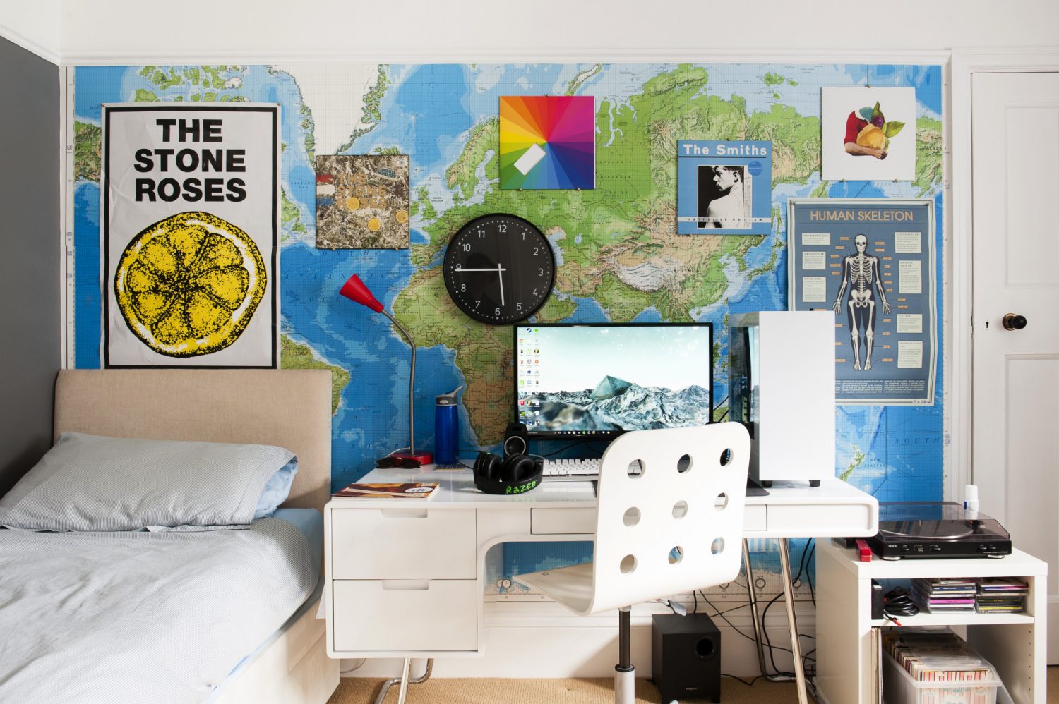 One wall of son Finn’s bedroom is papered with a world map and hung with favourite album covers