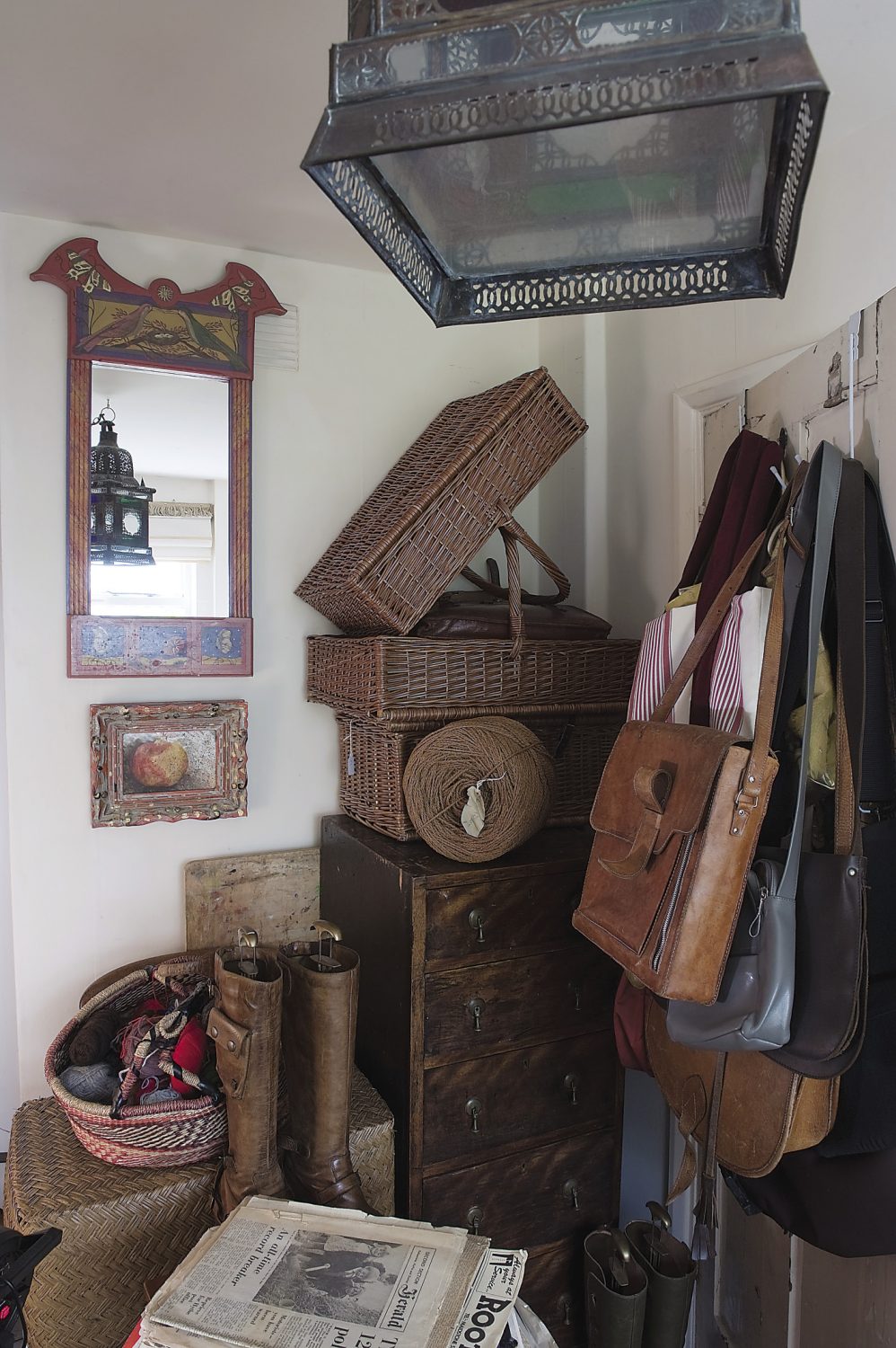 The spare room is currently filled with fascinating curios: furniture, leather bags, wool, old newspapers, postcards and even a taxidermy cockatoo