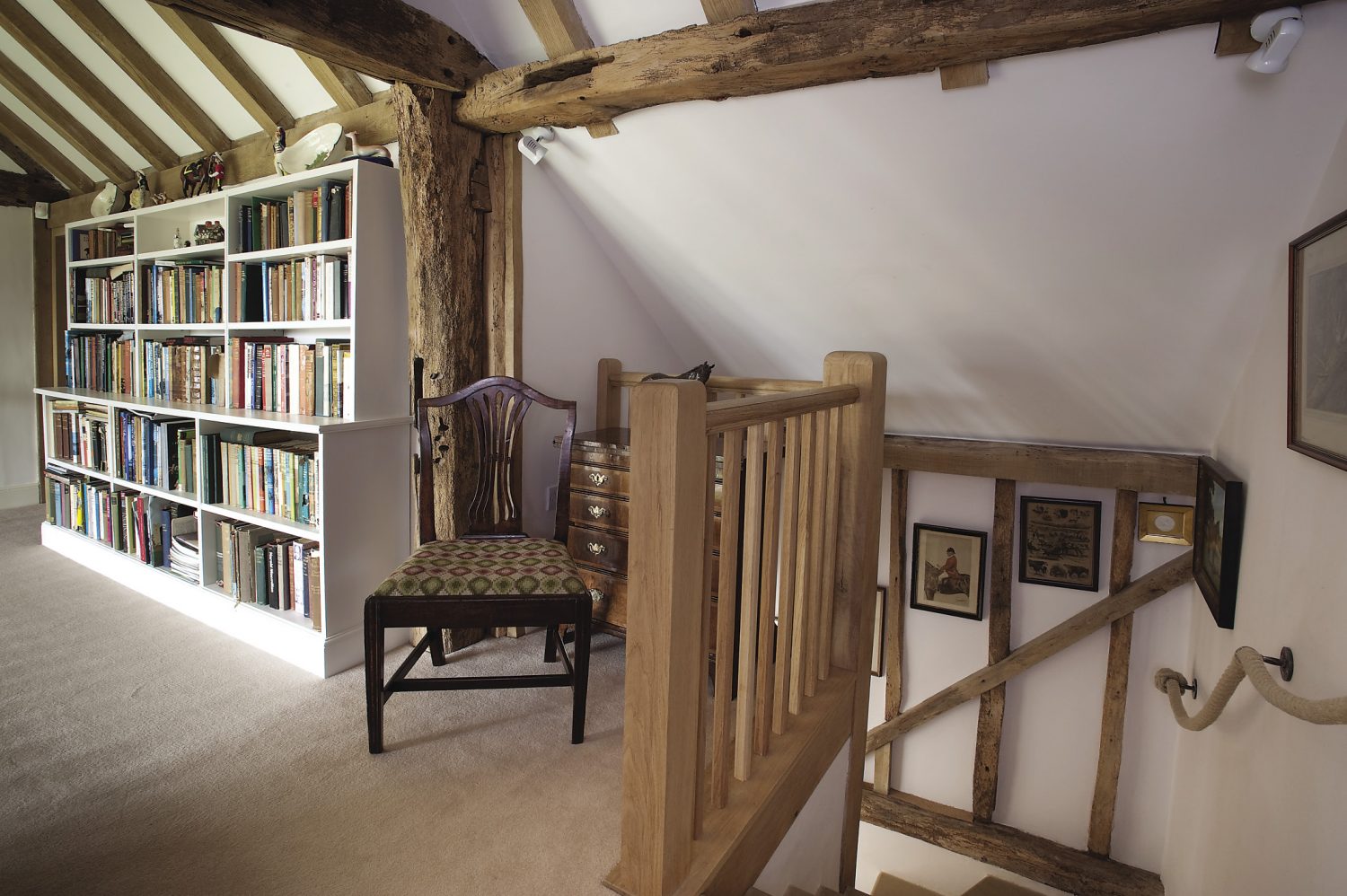 bookshelves made by Alpine Joinery of Frant stretch almost the length of the landing