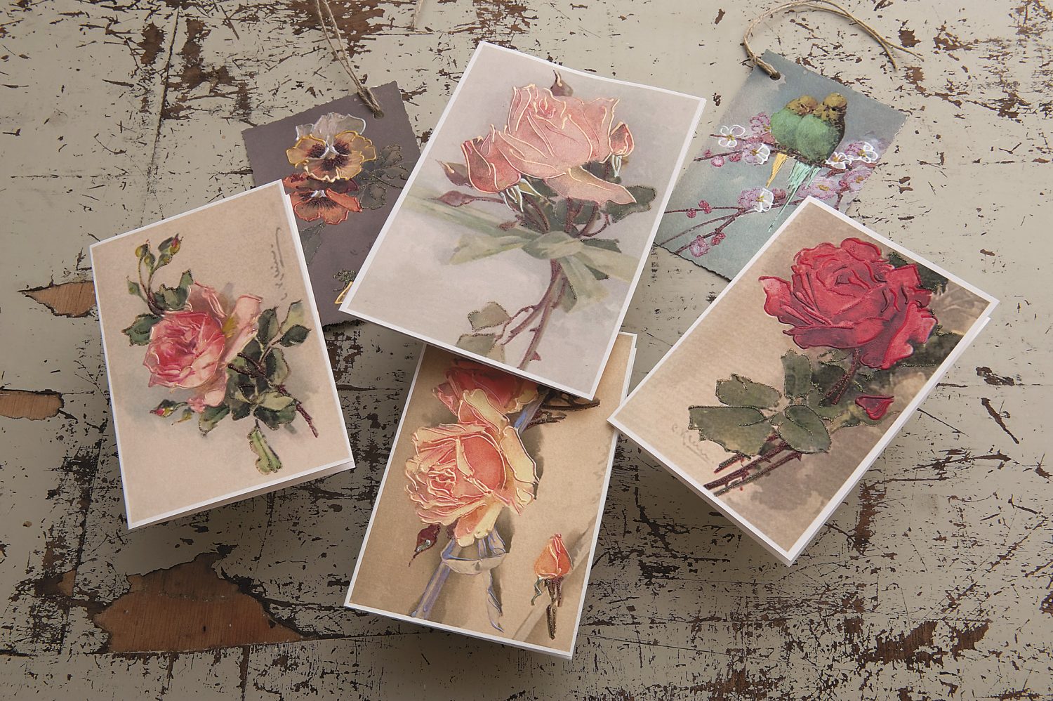 a selection of cards displayed on the distressed dining-room table