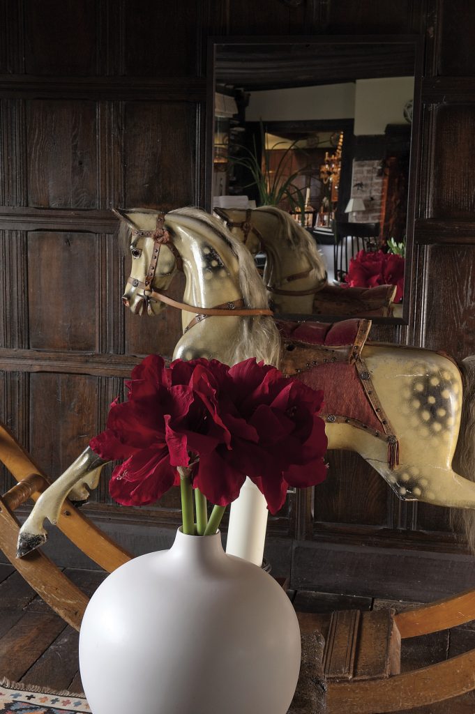 In the drawing room, between two lovely and small chaises longues, stands the perfect traditional rocking horse, its saddle, bridle, mane and tail all gently restored by a local saddler